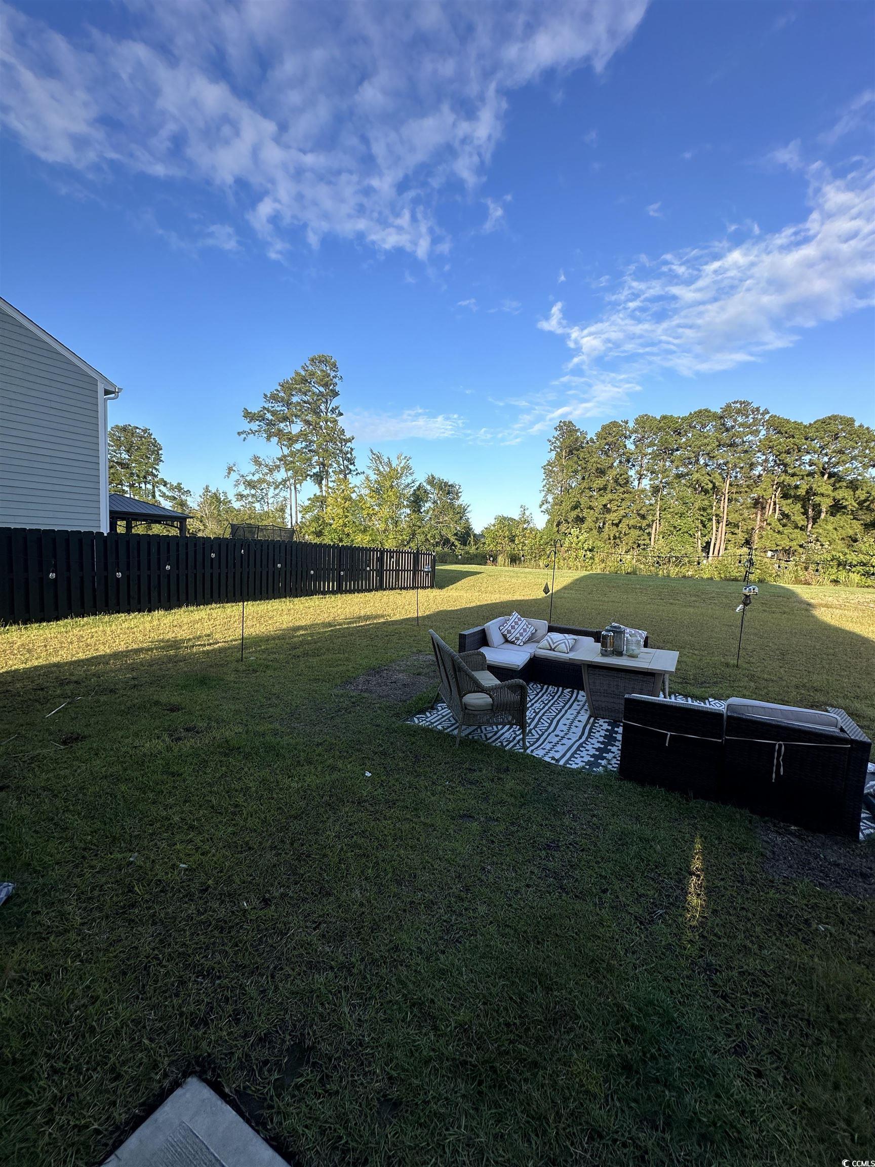 2655 Pegasus Place Myrtle Beach, SC 29577 - Photo 30 of 30 View of yard with outdoor lounge area and a patio area