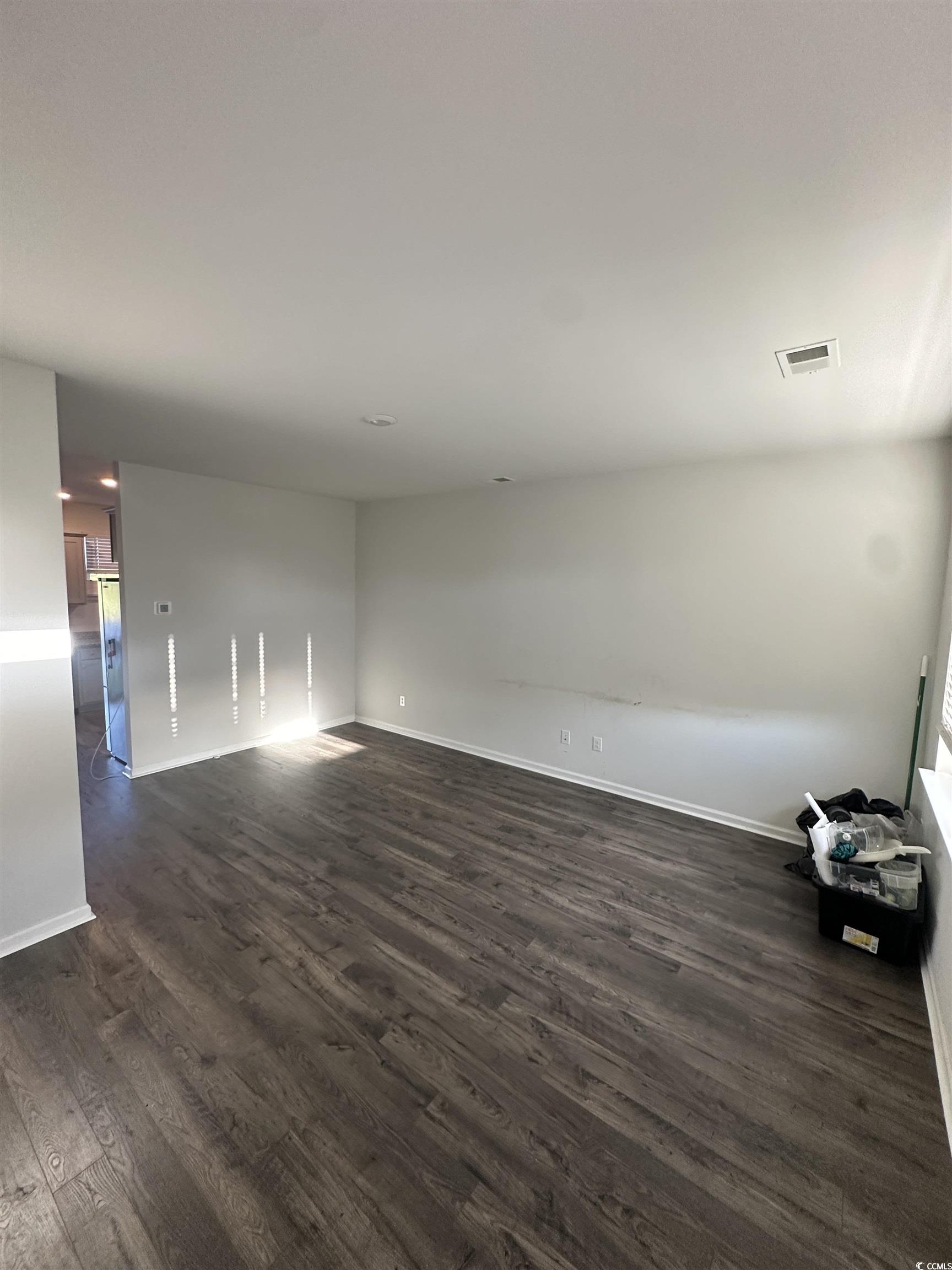 2655 Pegasus Place Myrtle Beach, SC 29577 - Photo 3 of 30 Spare room featuring dark wood-style floors and baseboards