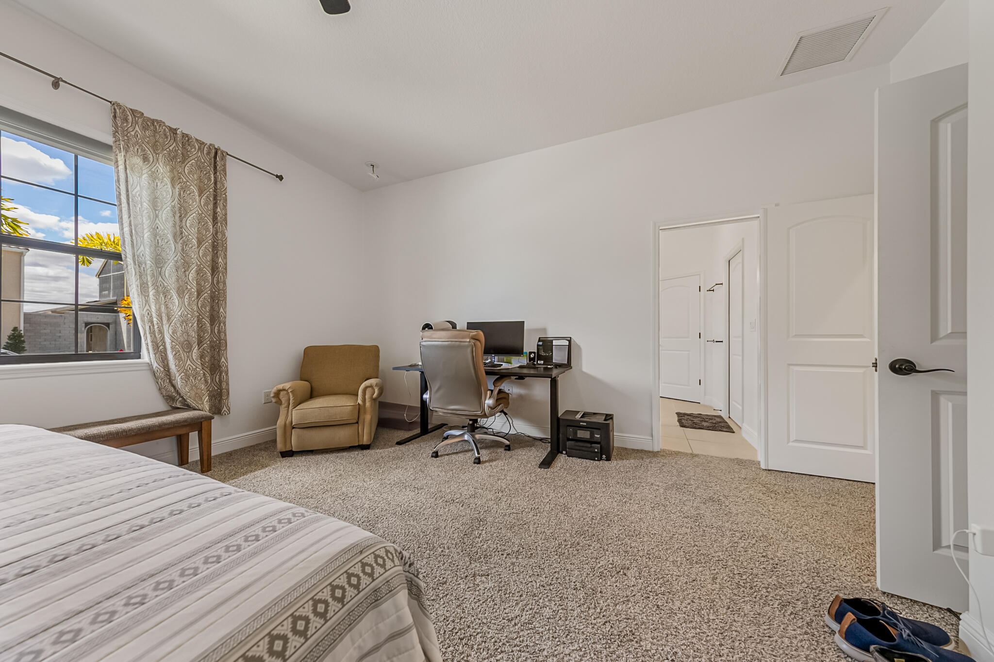 2342 Addison Drive Melbourne, FL 32940 - Photo 12 of 69 a bedroom with a bed and a large window