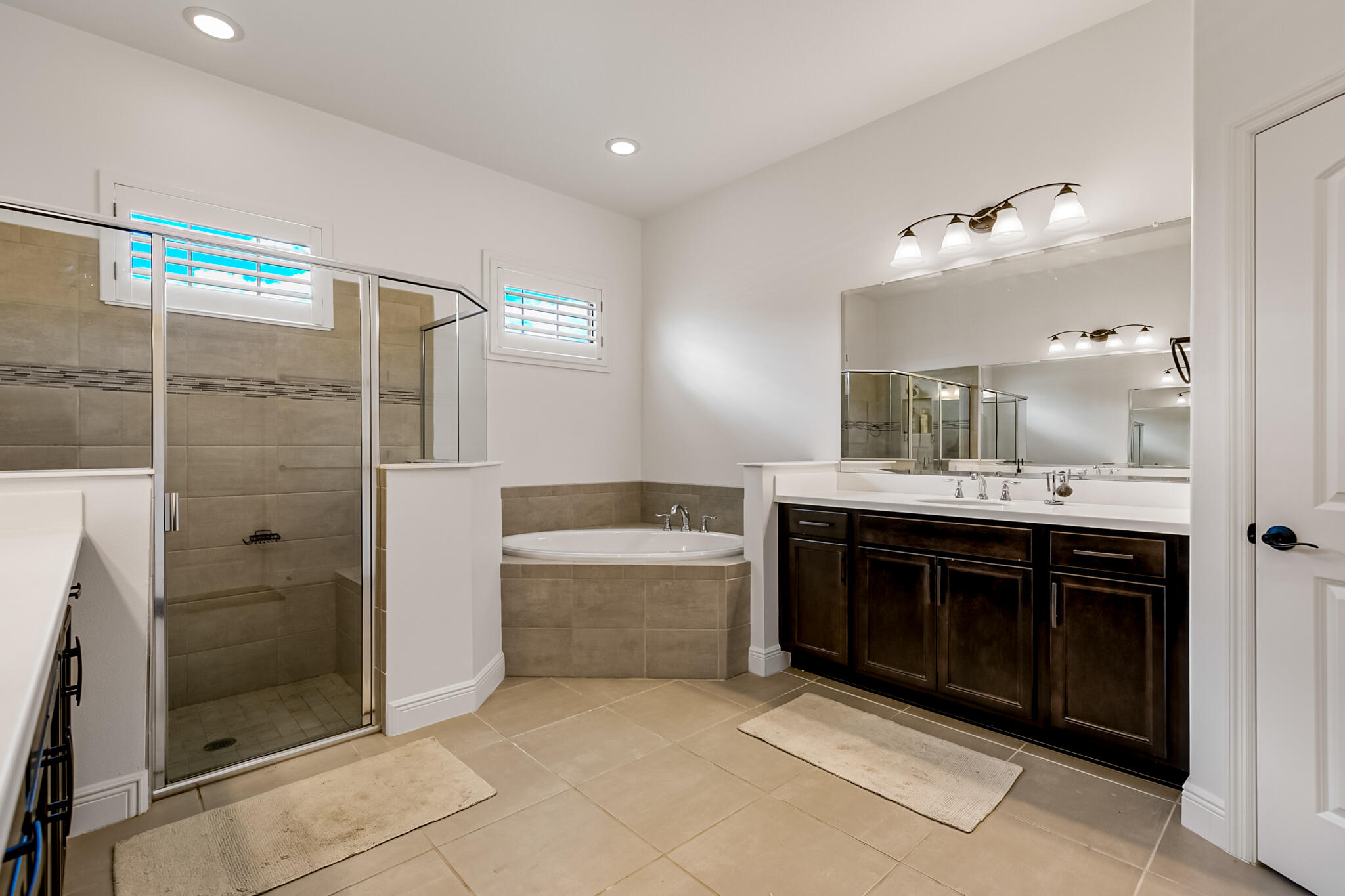 2342 Addison Drive Melbourne, FL 32940 - Photo 15 of 69 a bathroom with a sink double vanity and a shower