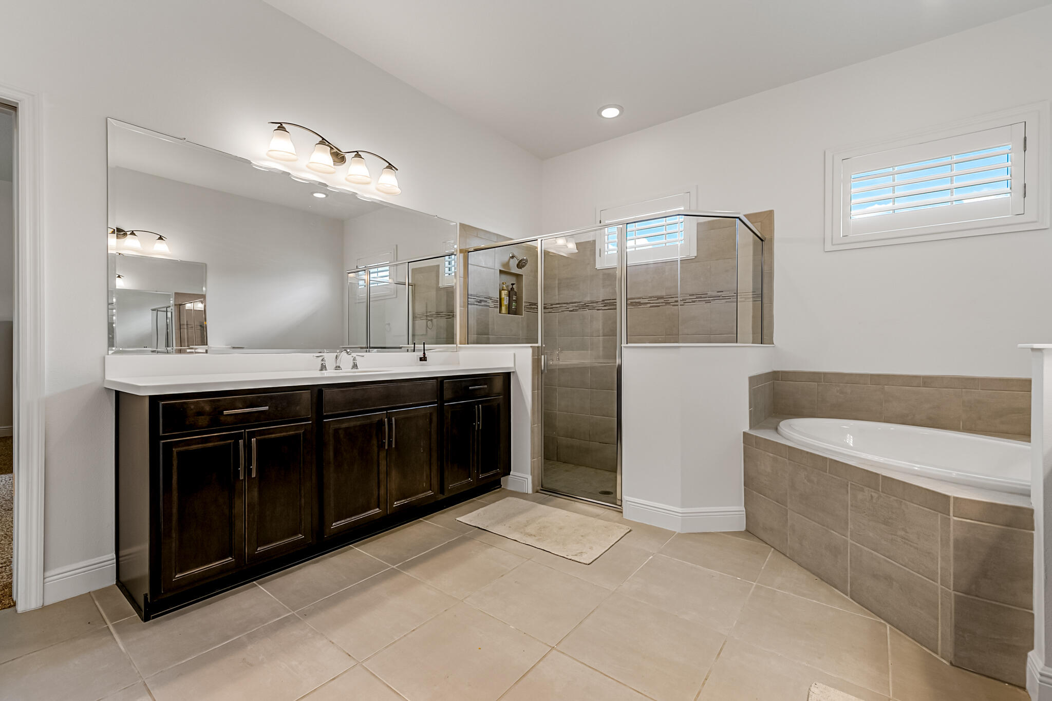 2342 Addison Drive Melbourne, FL 32940 - Photo 16 of 69 a spacious bathroom with a tub sink shower and mirror