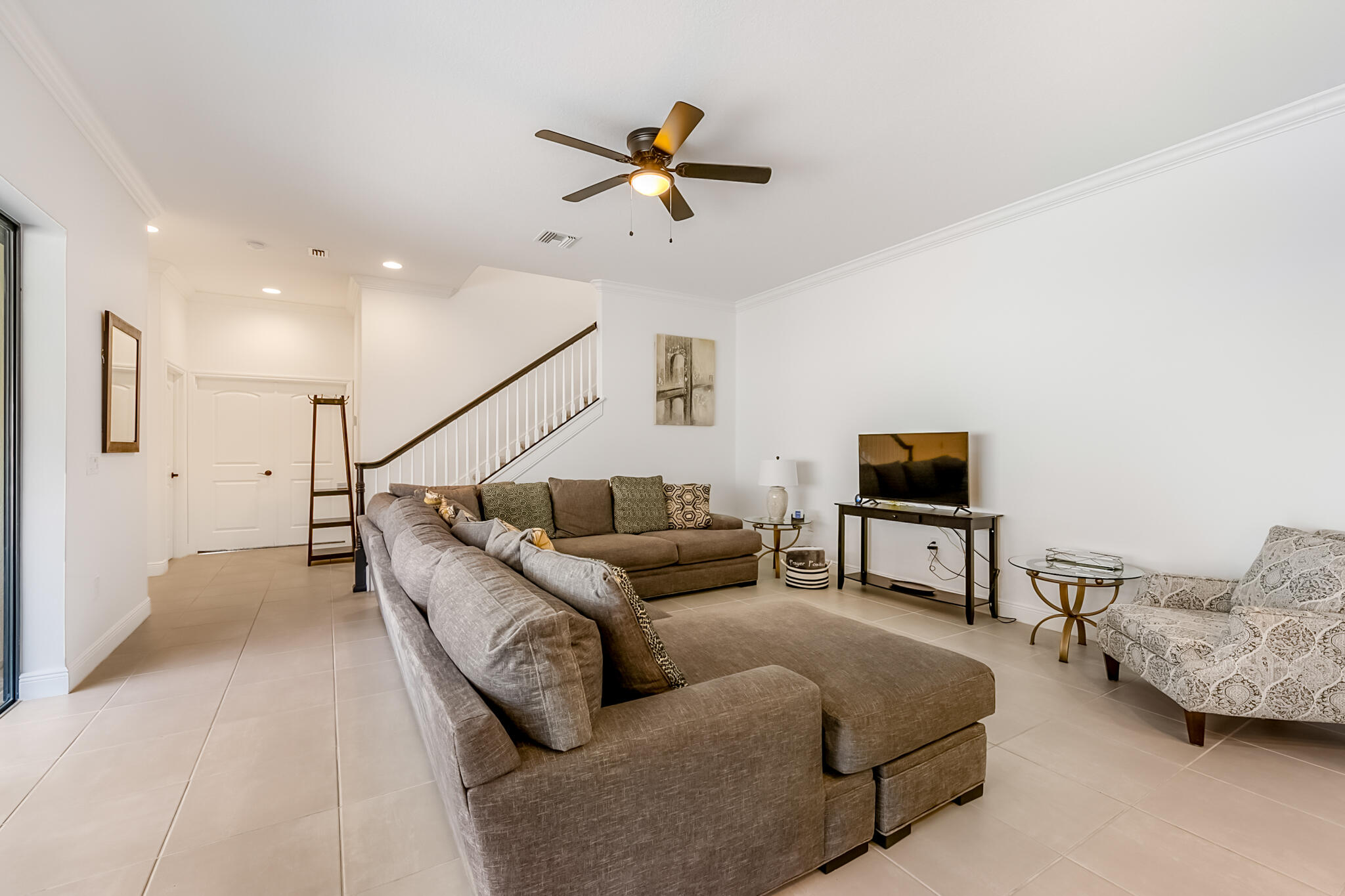 2342 Addison Drive Melbourne, FL 32940 - Photo 18 of 69 a living room with furniture and a flat screen tv