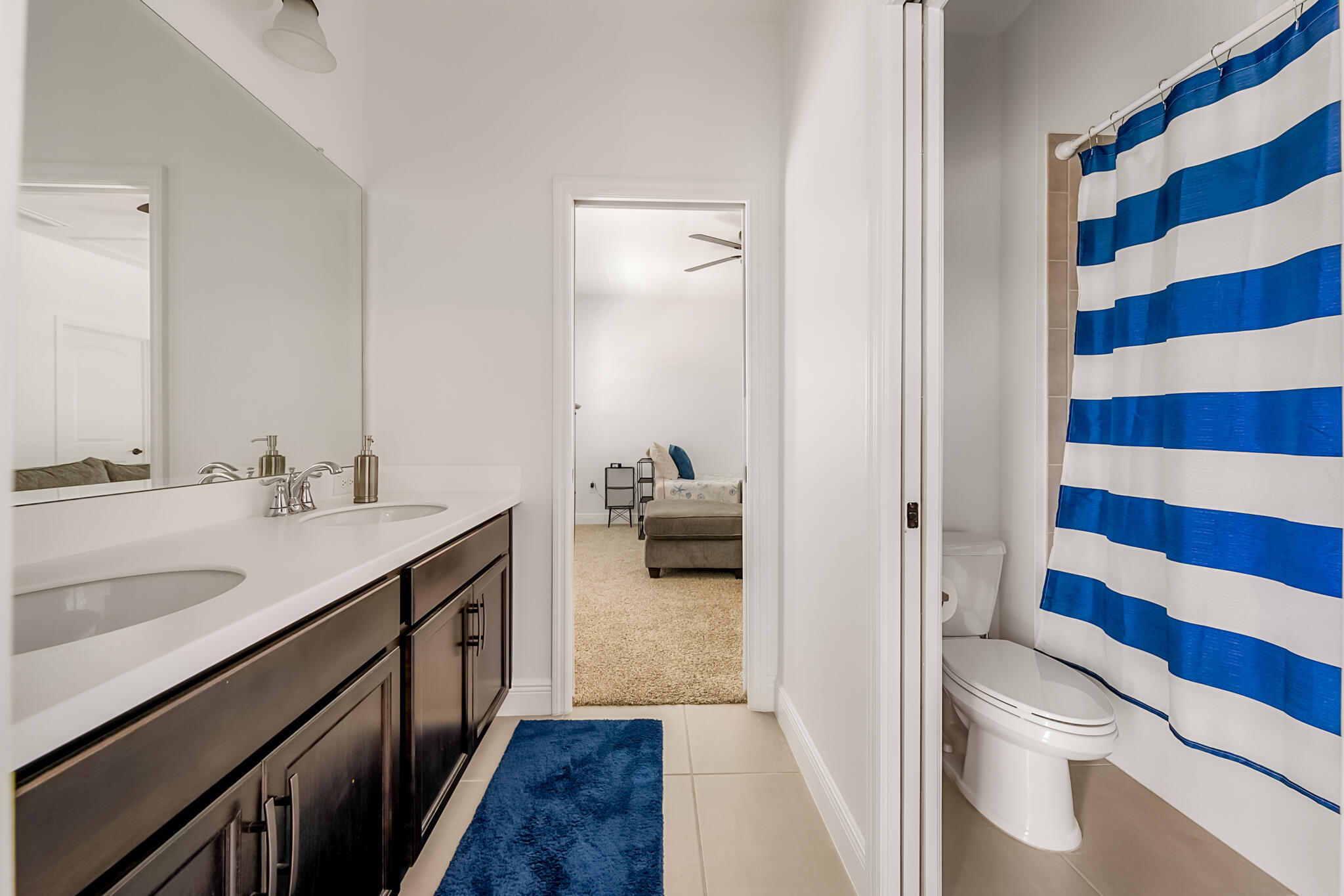 2342 Addison Drive Melbourne, FL 32940 - Photo 27 of 69 a en suite bathroom with a sink a toilet and shower