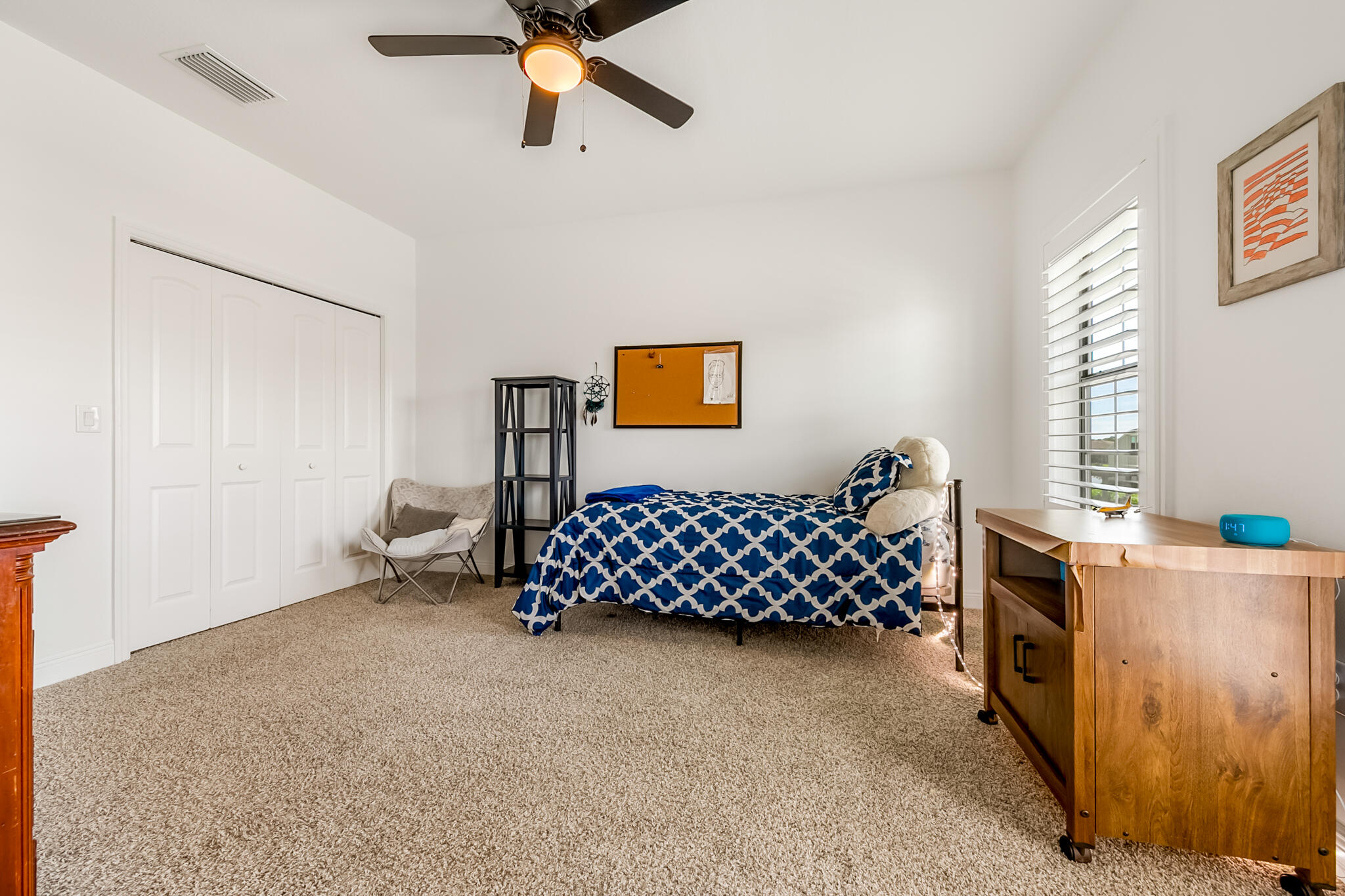 2342 Addison Drive Melbourne, FL 32940 - Photo 28 of 69 a bedroom with a bed and a window