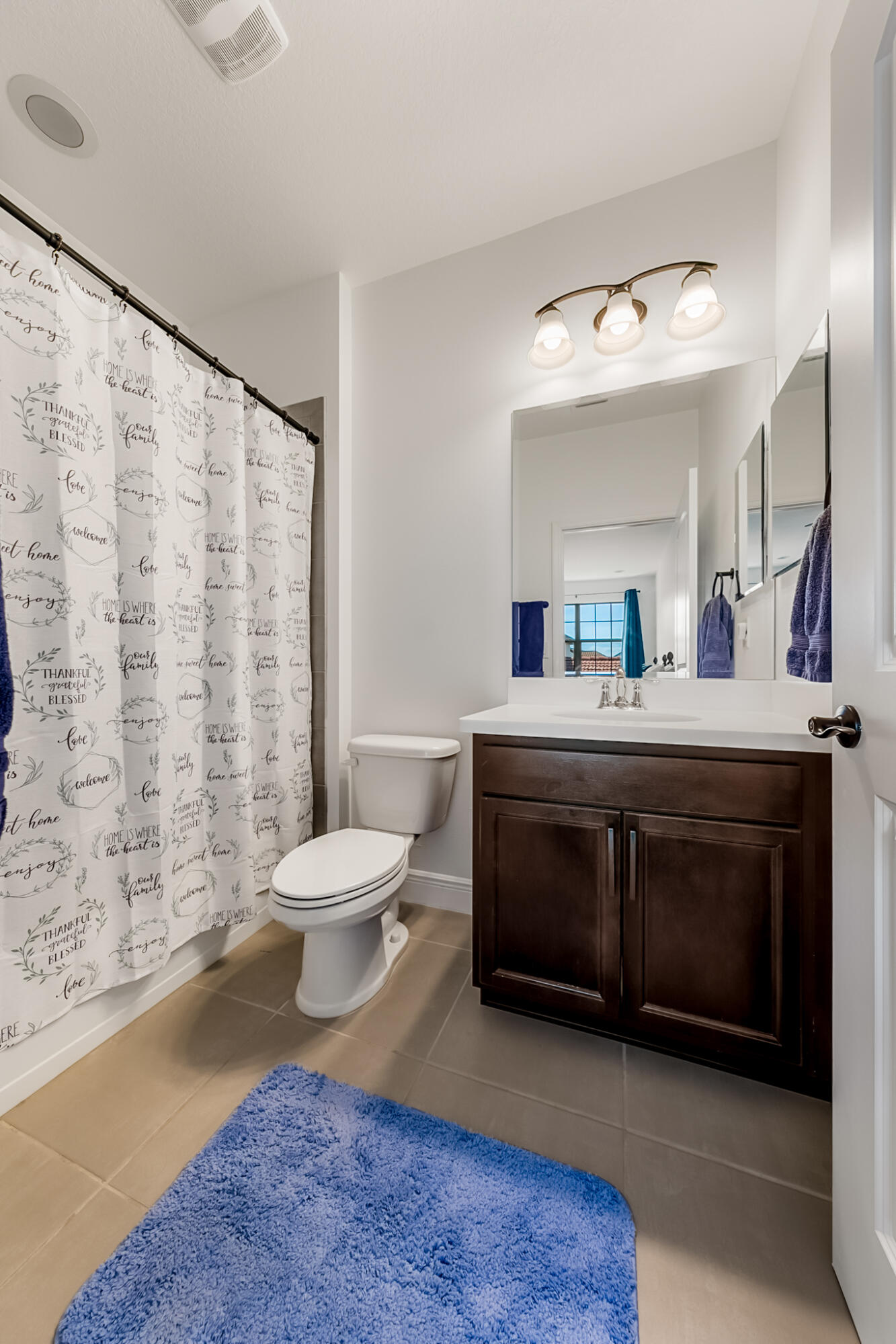 2342 Addison Drive Melbourne, FL 32940 - Photo 34 of 69 a spacious bathroom with a double vanity sink toilet mirror and shower