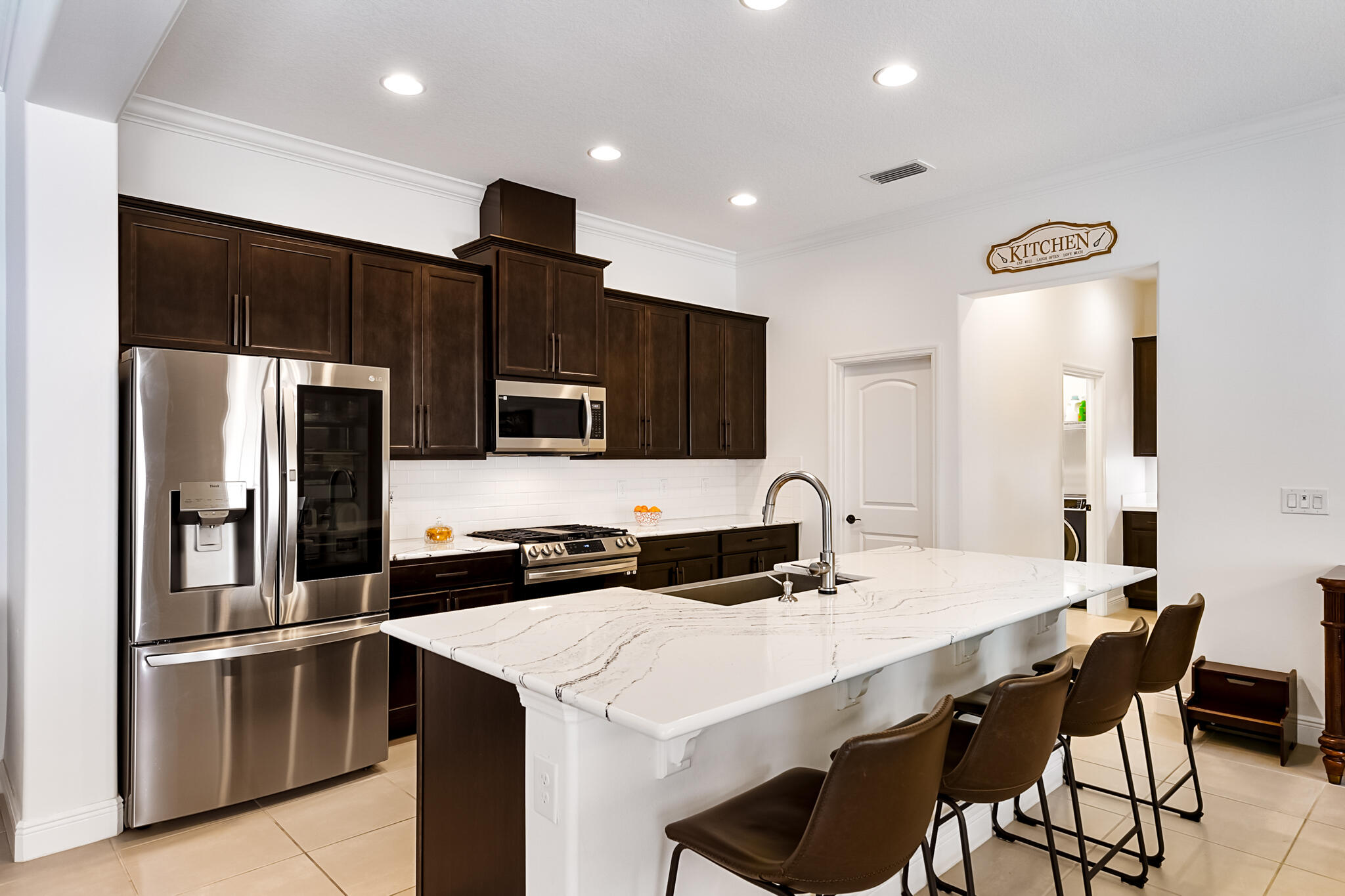 2342 Addison Drive Melbourne, FL 32940 - Photo 36 of 69 a kitchen with stainless steel appliances a refrigerator and a stove