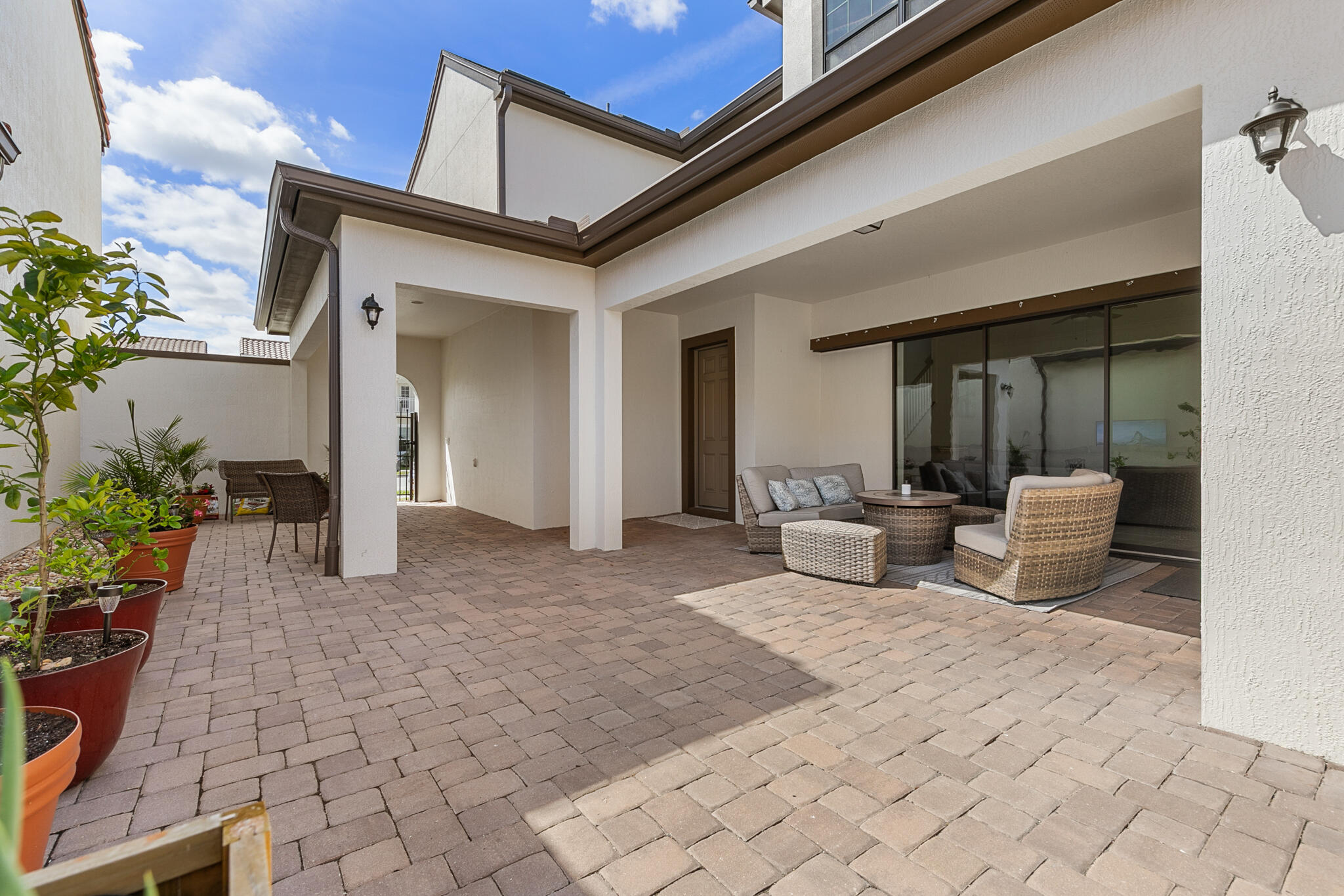 2342 Addison Drive Melbourne, FL 32940 - Photo 4 of 69 a view of a patio with table and chairs potted plants and a table