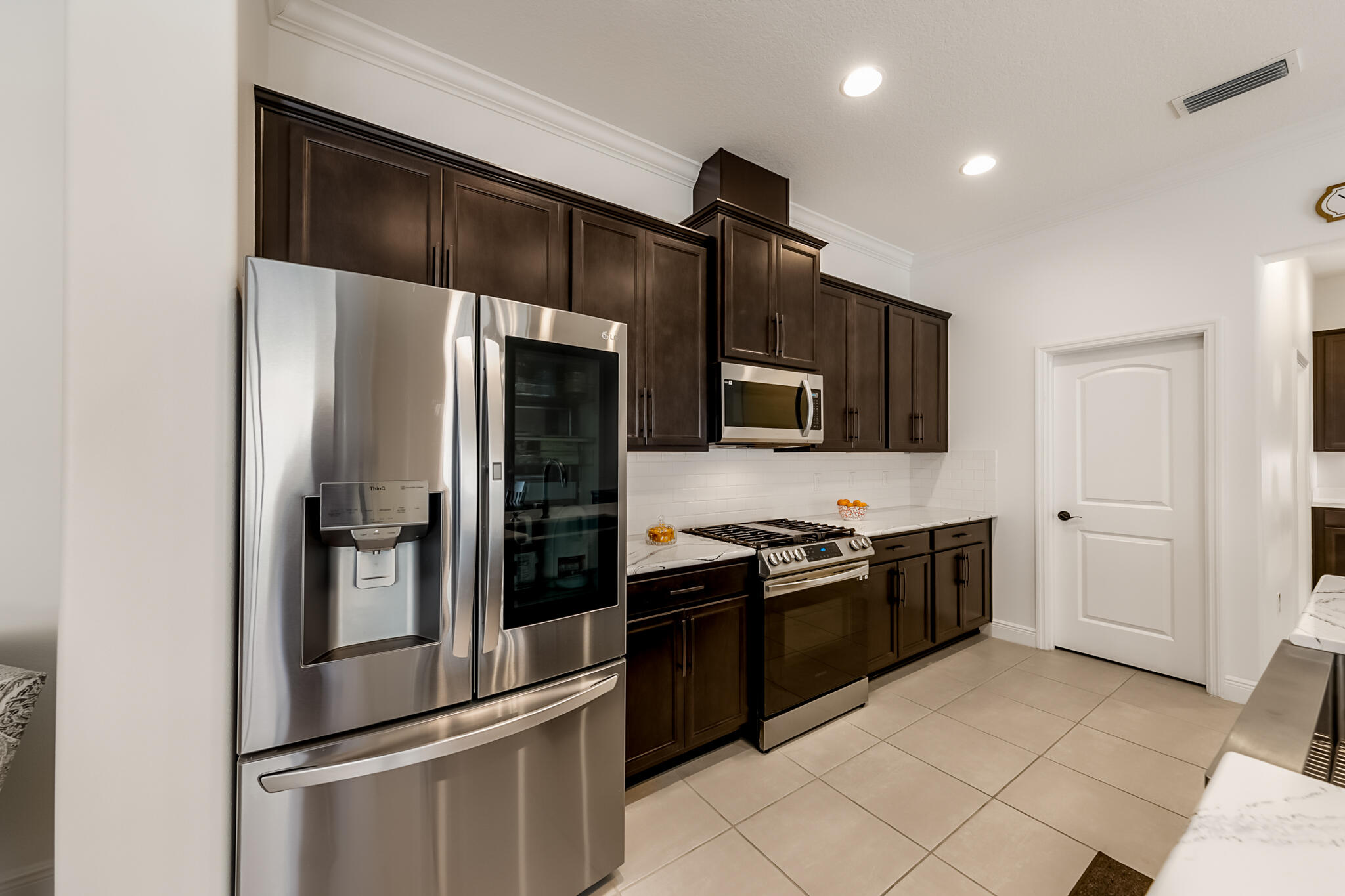 2342 Addison Drive Melbourne, FL 32940 - Photo 44 of 69 a kitchen with stainless steel appliances and refrigerator