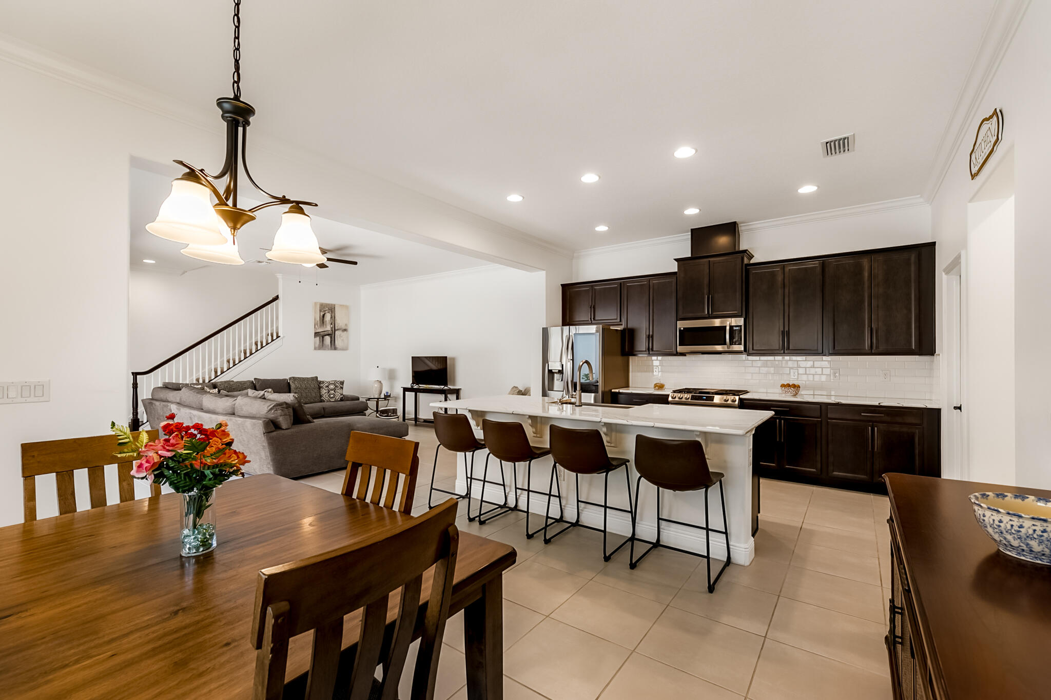 2342 Addison Drive Melbourne, FL 32940 - Photo 45 of 69 a living room with lots of furniture and kitchen view