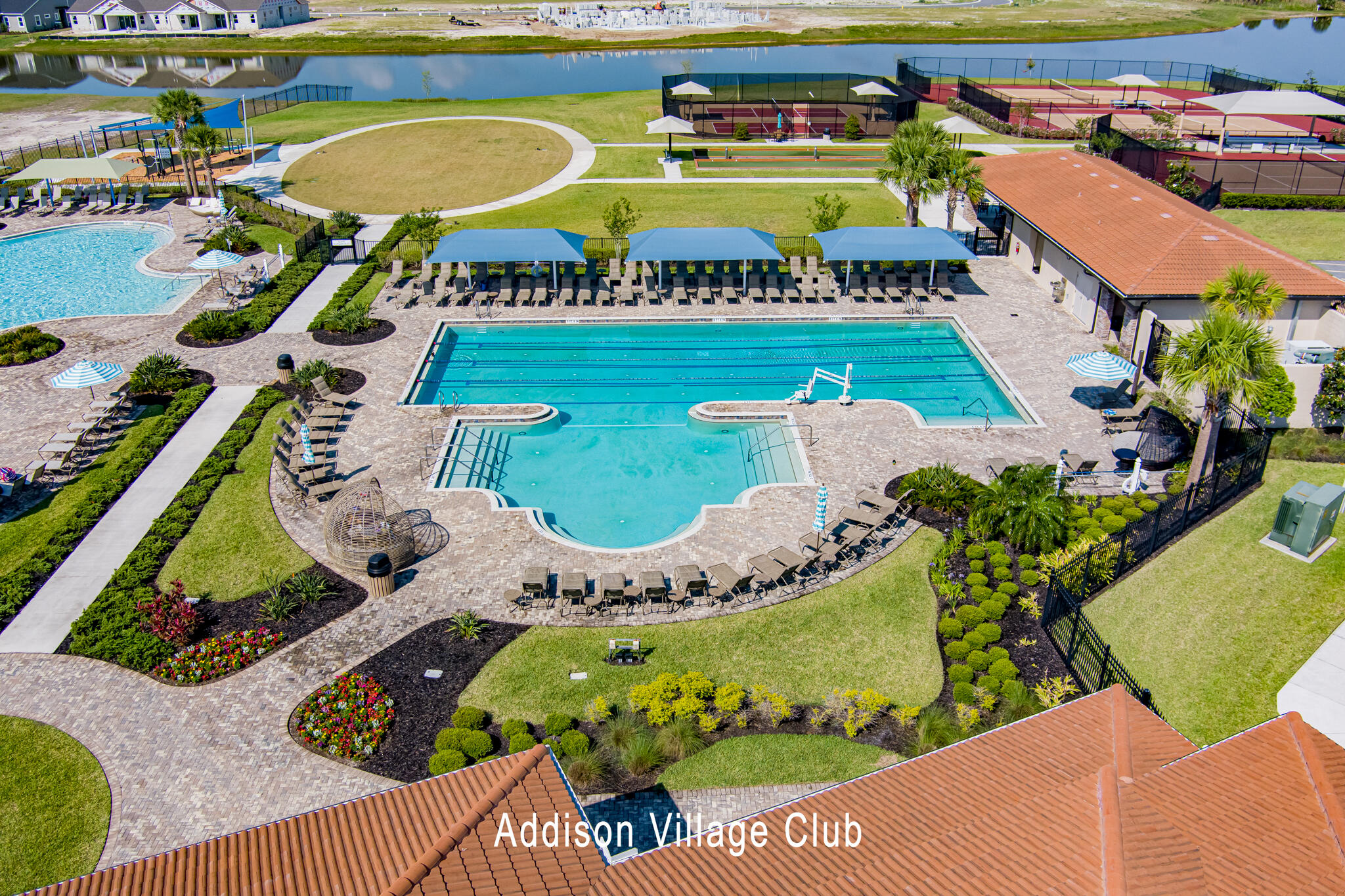 2342 Addison Drive Melbourne, FL 32940 - Photo 65 of 69 an aerial view of a house with a garden and lake view