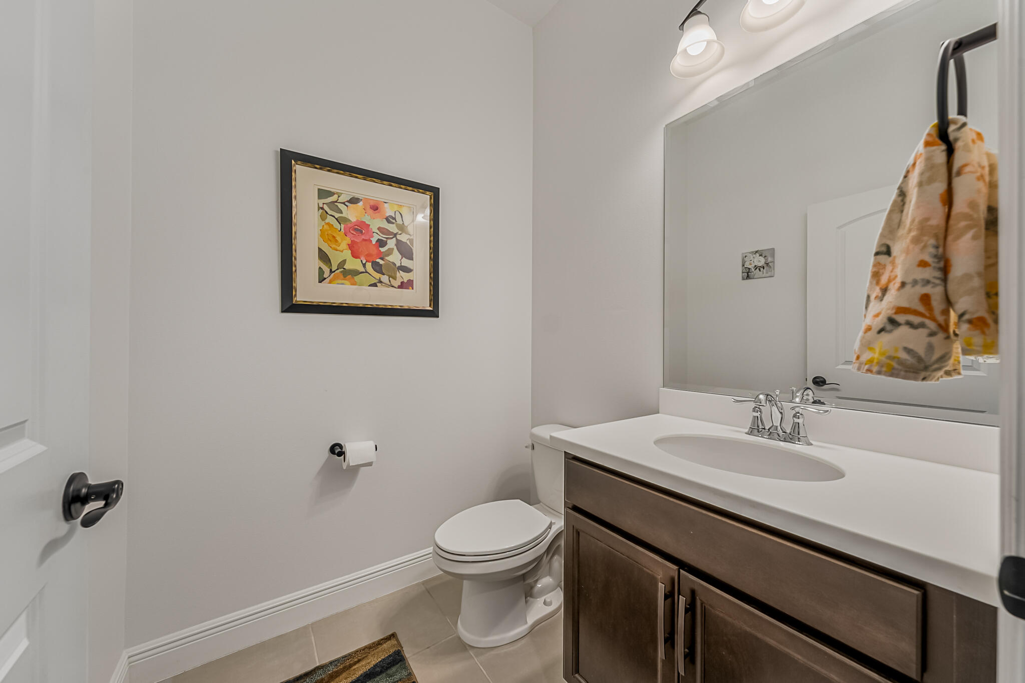 2342 Addison Drive Melbourne, FL 32940 - Photo 9 of 69 a bathroom with a sink mirror vanity and toilet