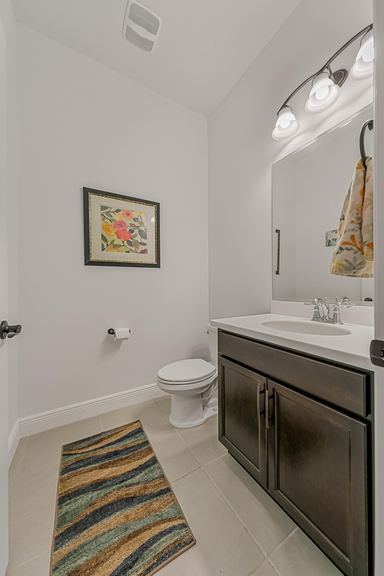 2342 Addison Drive Melbourne, FL 32940 - Photo 10 of 69 a bathroom with a sink a toilet and mirror