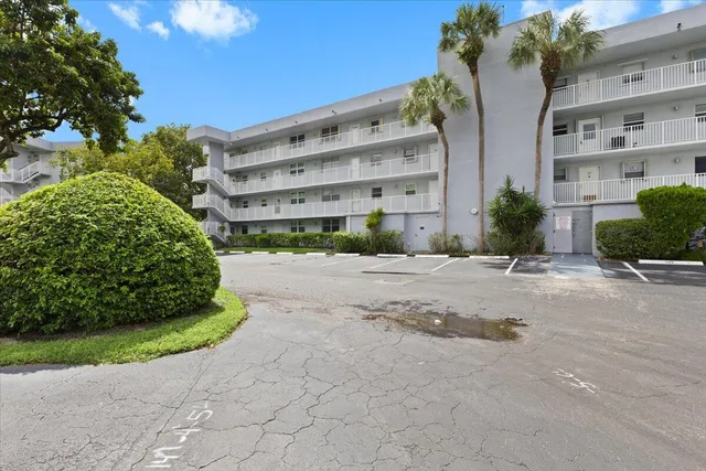 a view of a building with a yard