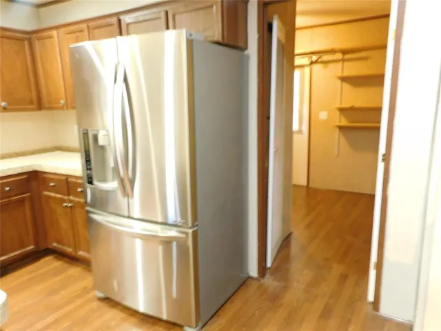 a stove top oven sitting inside of a kitchen