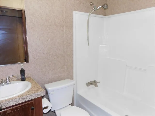 a view of a wooden door and a yard