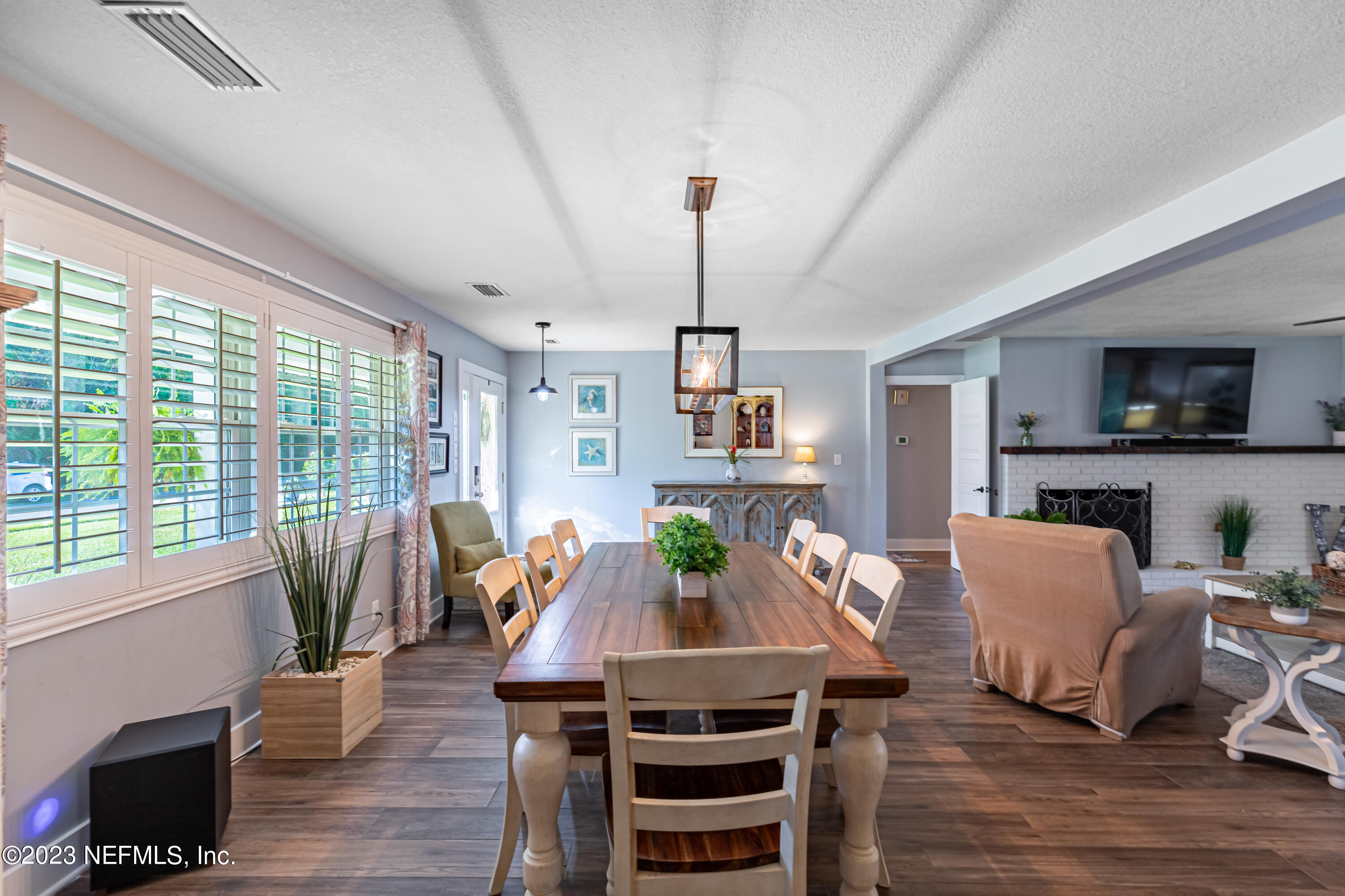 3467 Eunice Road Jacksonville, FL 32250 - Photo 18 of 83 a view of a dining room with furniture window and wooden floor
