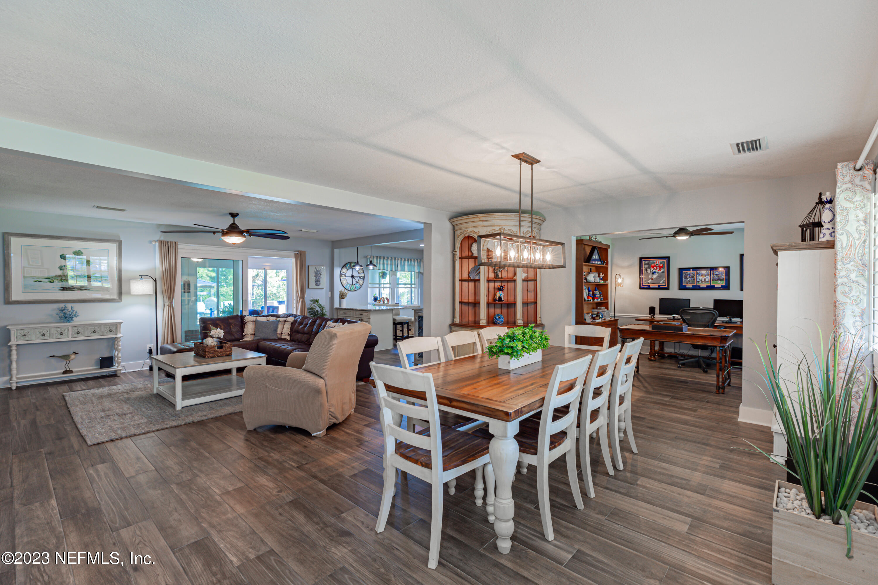 3467 Eunice Road Jacksonville, FL 32250 - Photo 19 of 83 a view of a dining room with furniture window and wooden floor