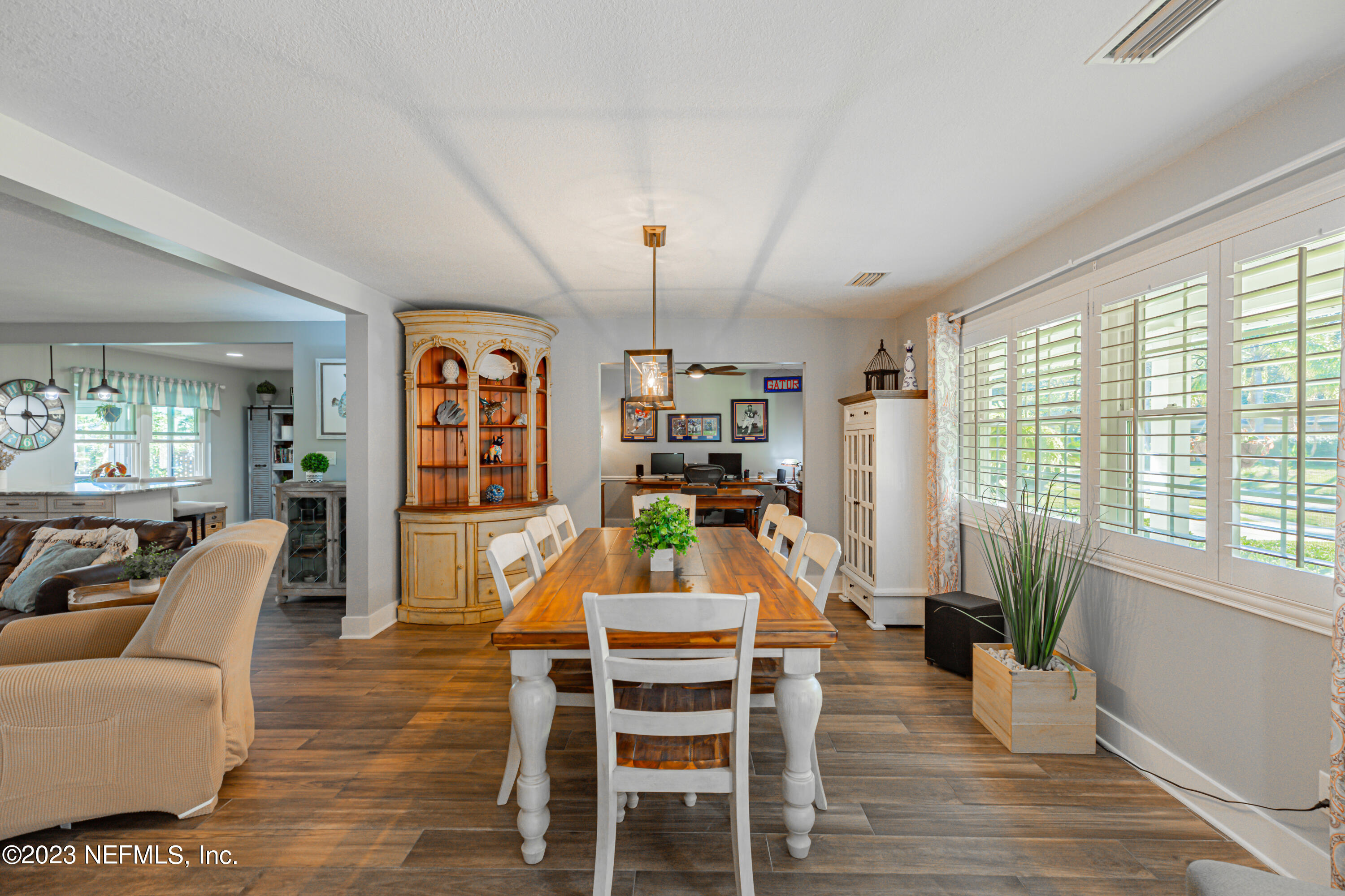 3467 Eunice Road Jacksonville, FL 32250 - Photo 21 of 83 a view of a dining room with furniture window and wooden floor