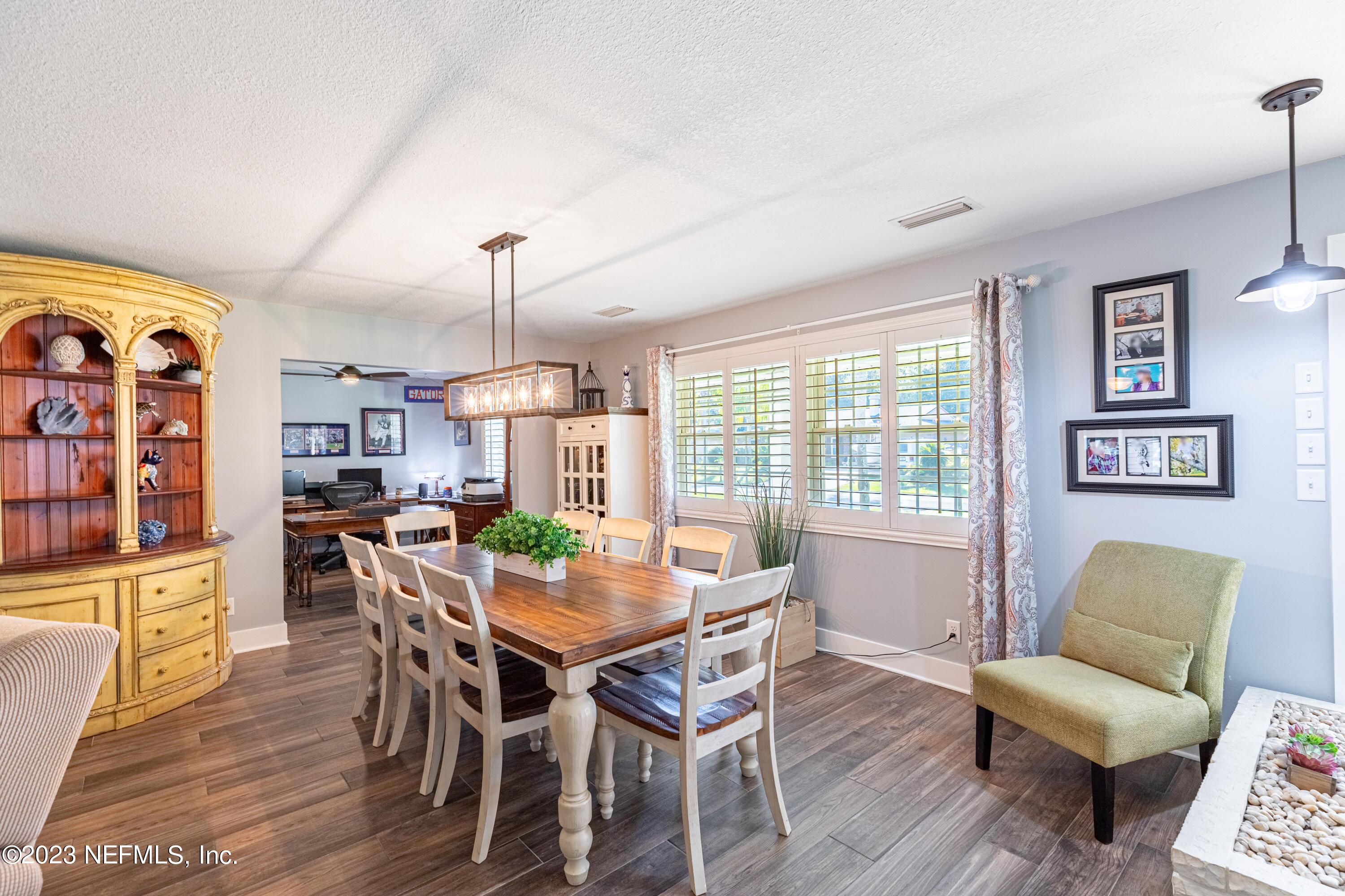 3467 Eunice Road Jacksonville, FL 32250 - Photo 22 of 83 a view of a dining room with furniture window and wooden floor