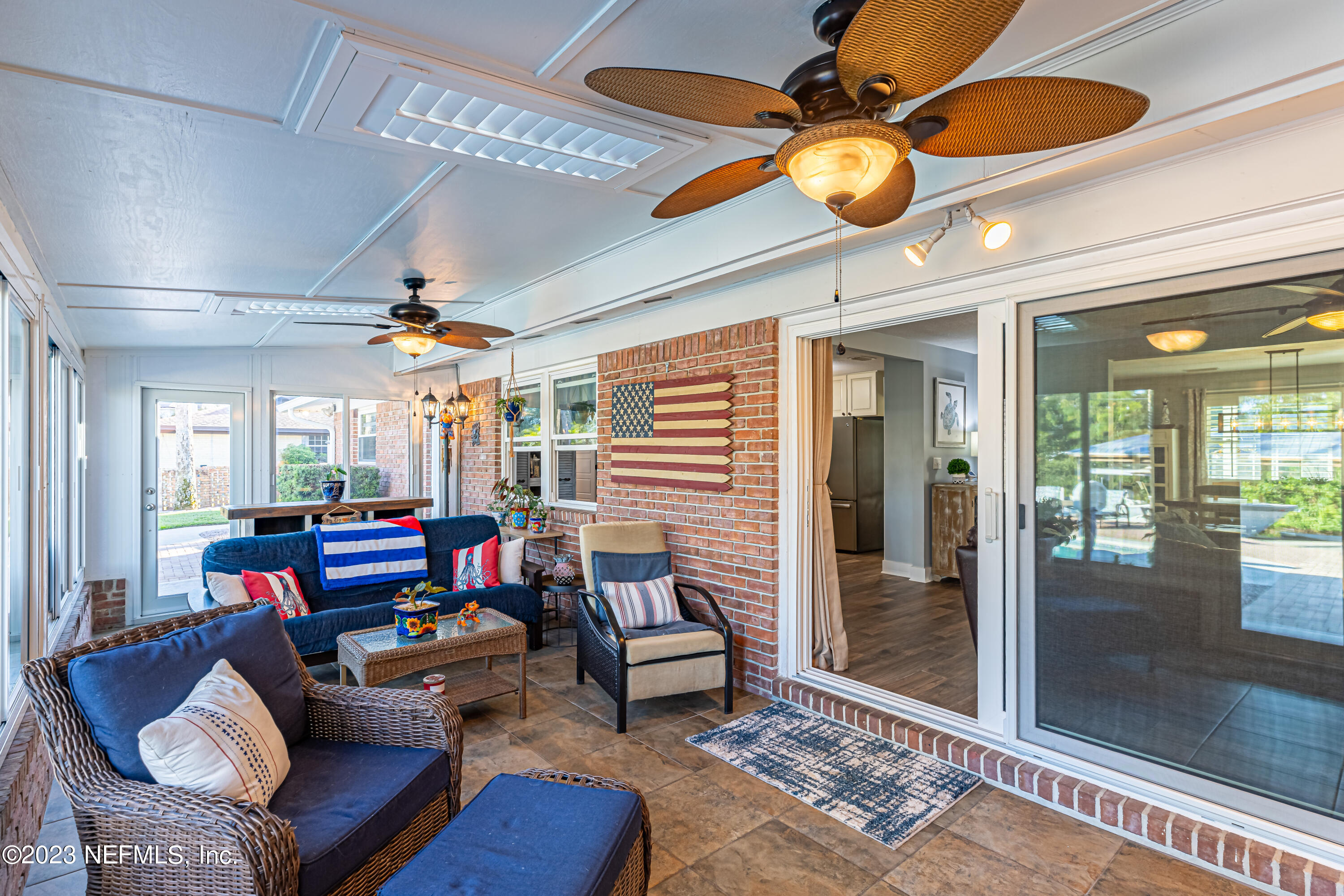3467 Eunice Road Jacksonville, FL 32250 - Photo 23 of 83 a living room with furniture and chandelier