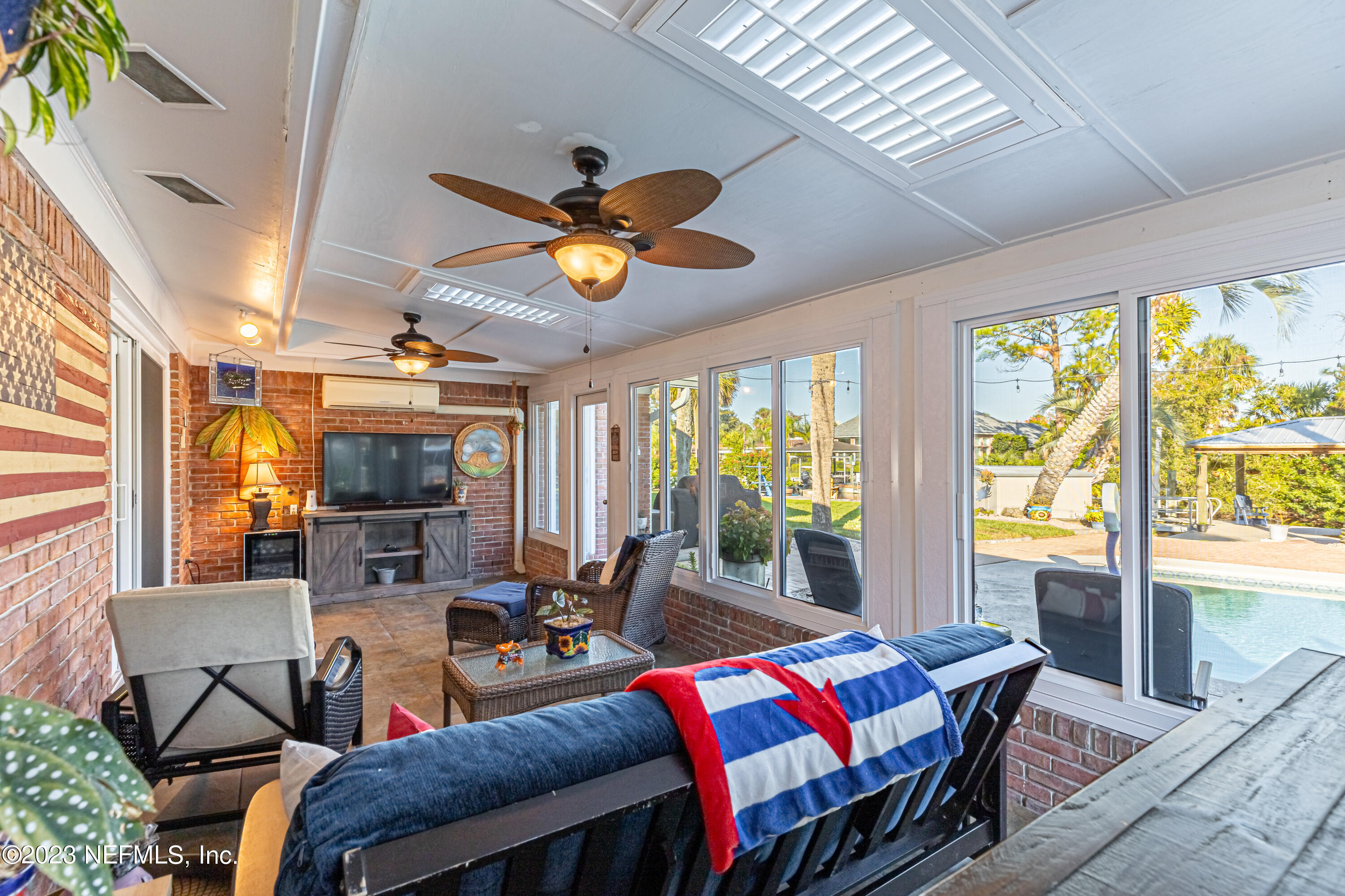 3467 Eunice Road Jacksonville, FL 32250 - Photo 25 of 83 a bedroom with furniture and a large window