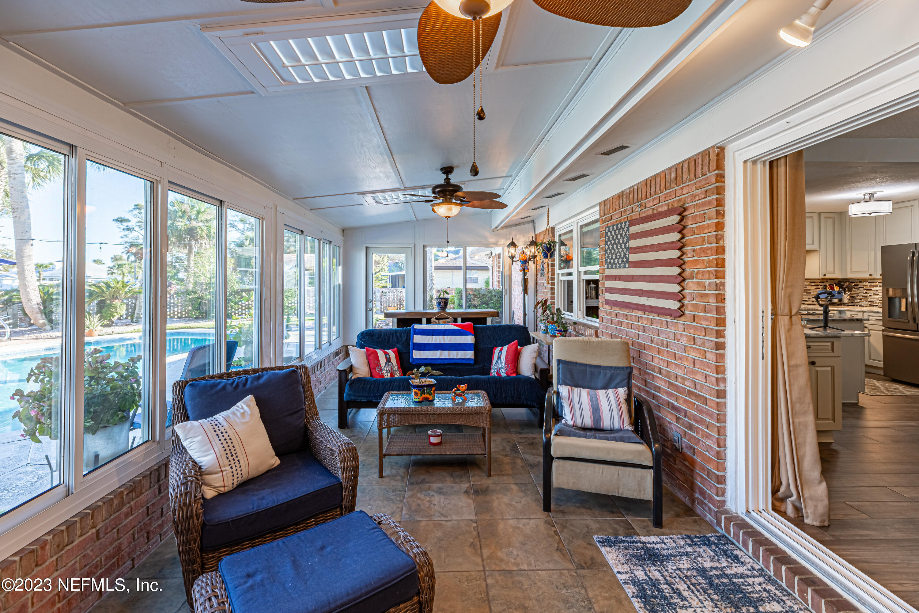 3467 Eunice Road Jacksonville, FL 32250 - Photo 26 of 83 a living room with furniture and a fireplace