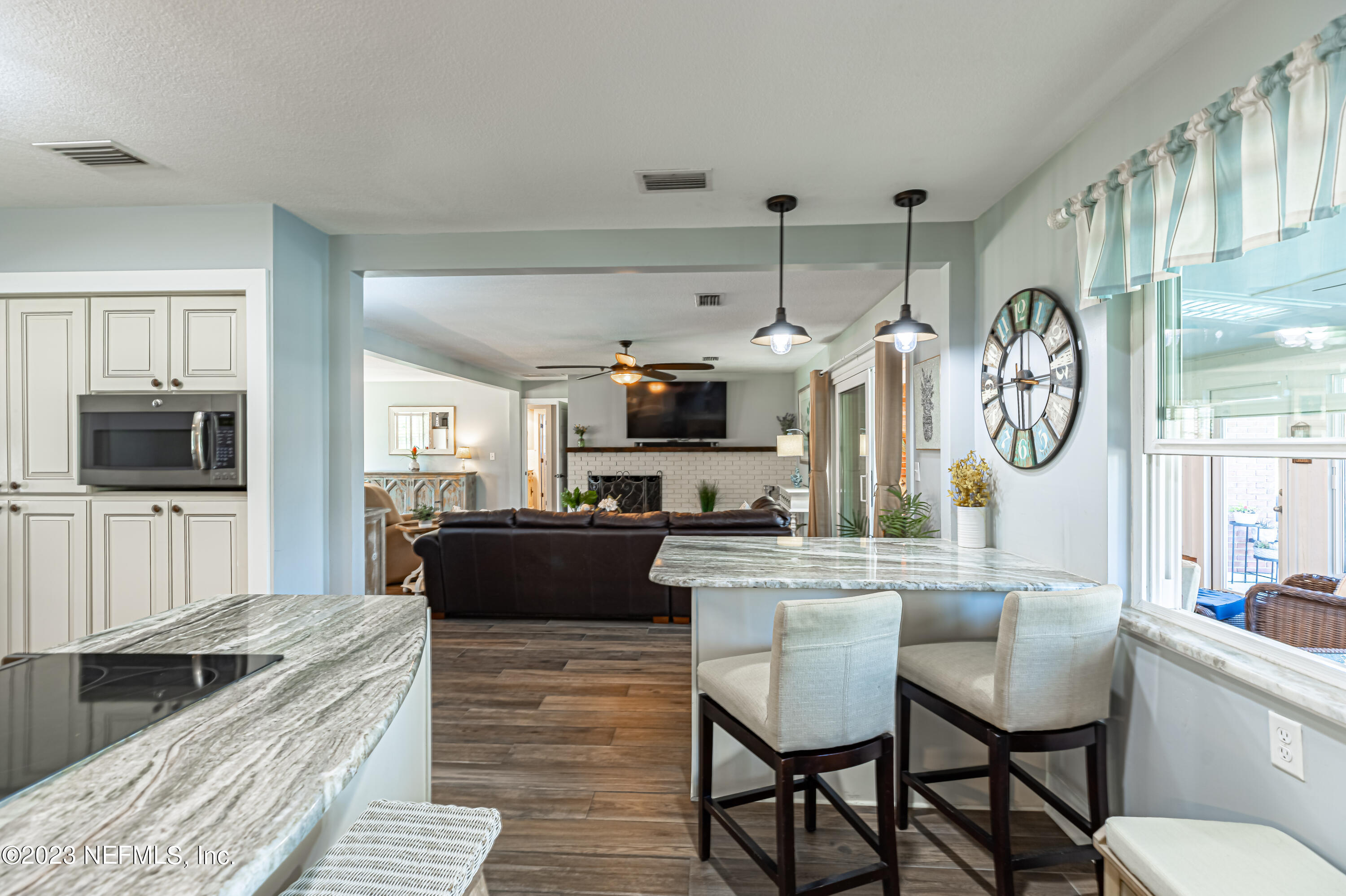 3467 Eunice Road Jacksonville, FL 32250 - Photo 31 of 83 a large kitchen with a table and chairs