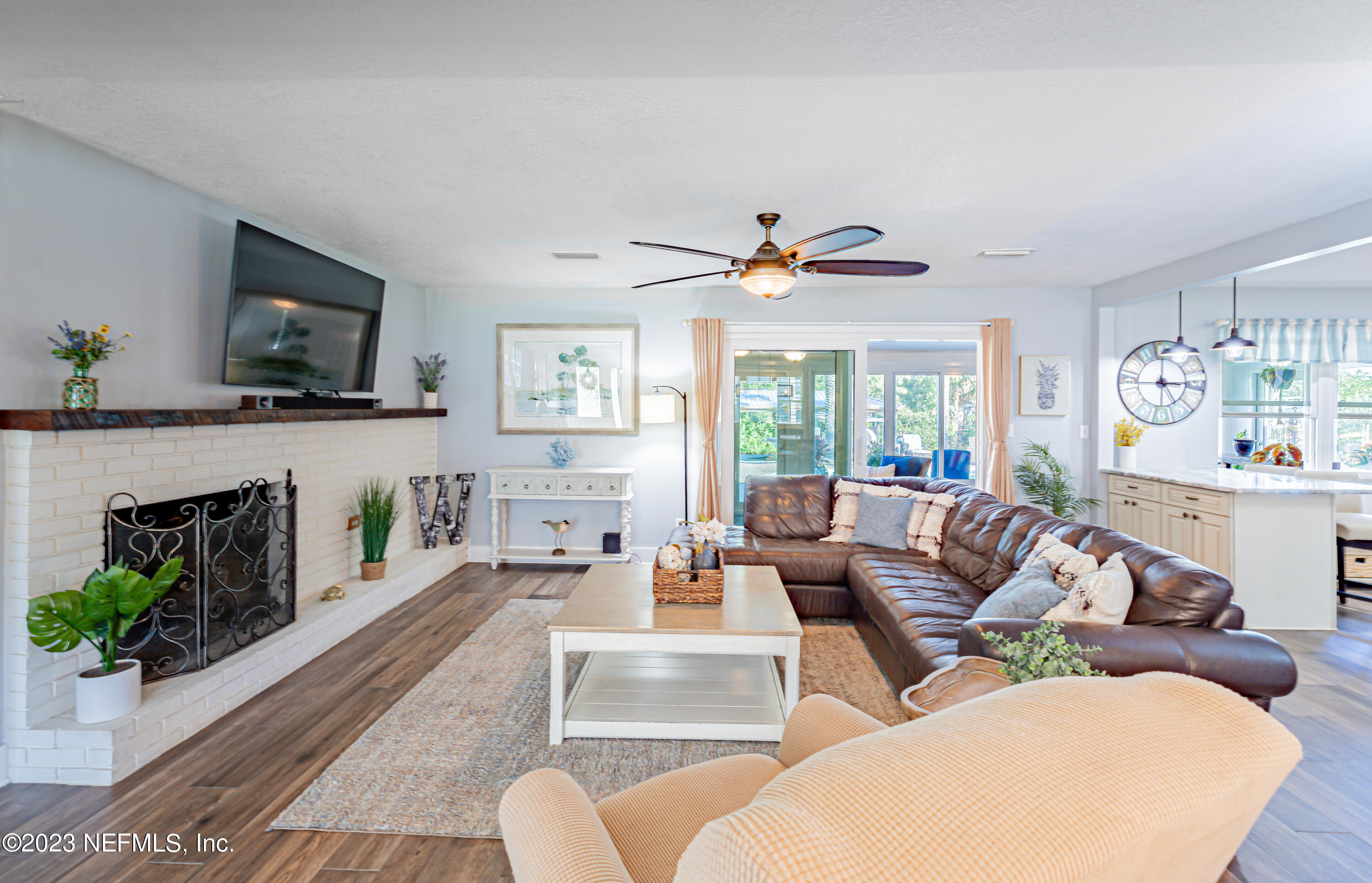 3467 Eunice Road Jacksonville, FL 32250 - Photo 37 of 83 a living room with fireplace furniture and a flat screen tv