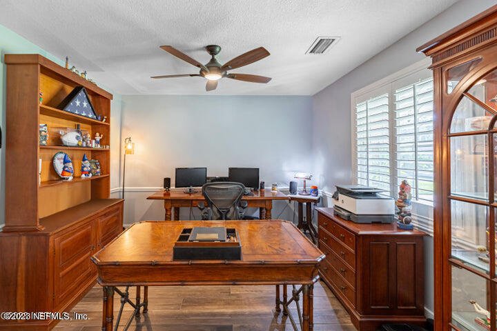 3467 Eunice Road Jacksonville, FL 32250 - Photo 43 of 83 a view of a workspace with furniture and a window