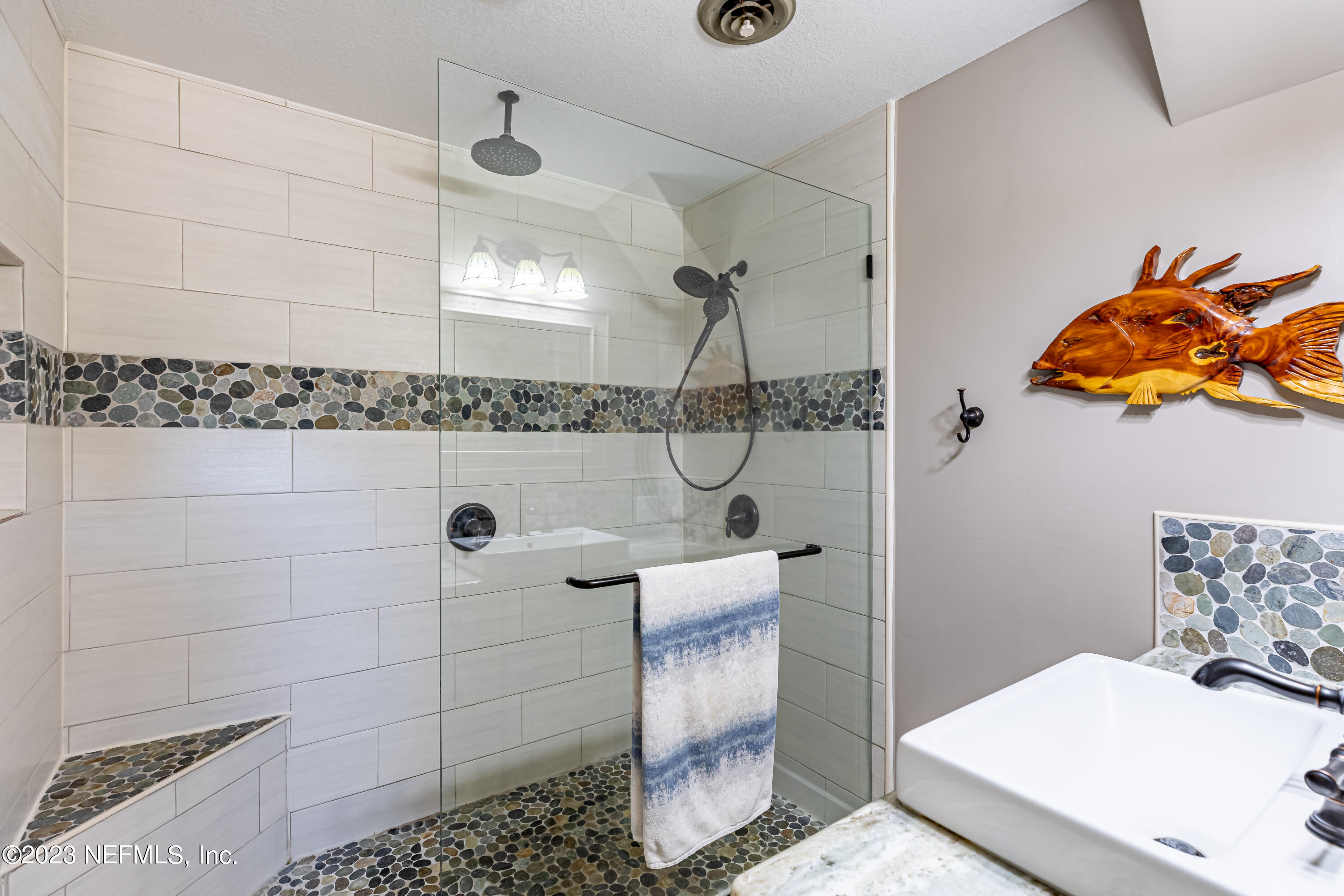 3467 Eunice Road Jacksonville, FL 32250 - Photo 46 of 83 a bathroom with a sink toilet and shower