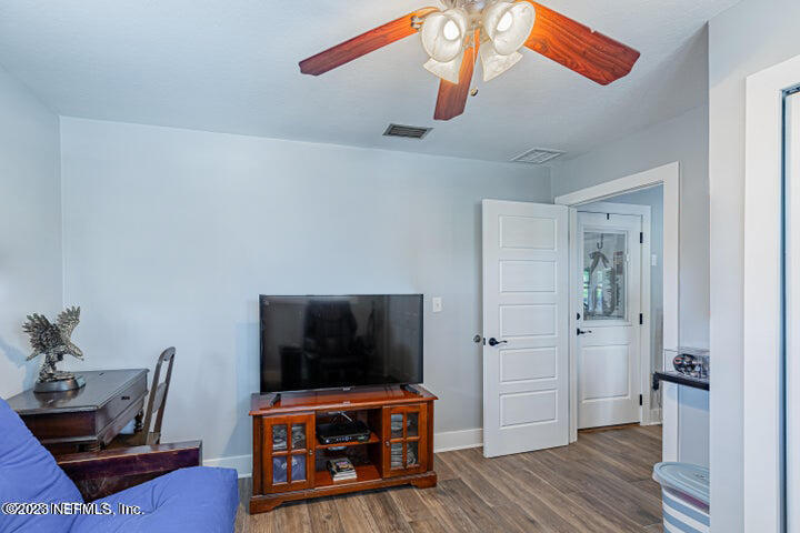 3467 Eunice Road Jacksonville, FL 32250 - Photo 59 of 83 a living room with furniture and a flat screen tv