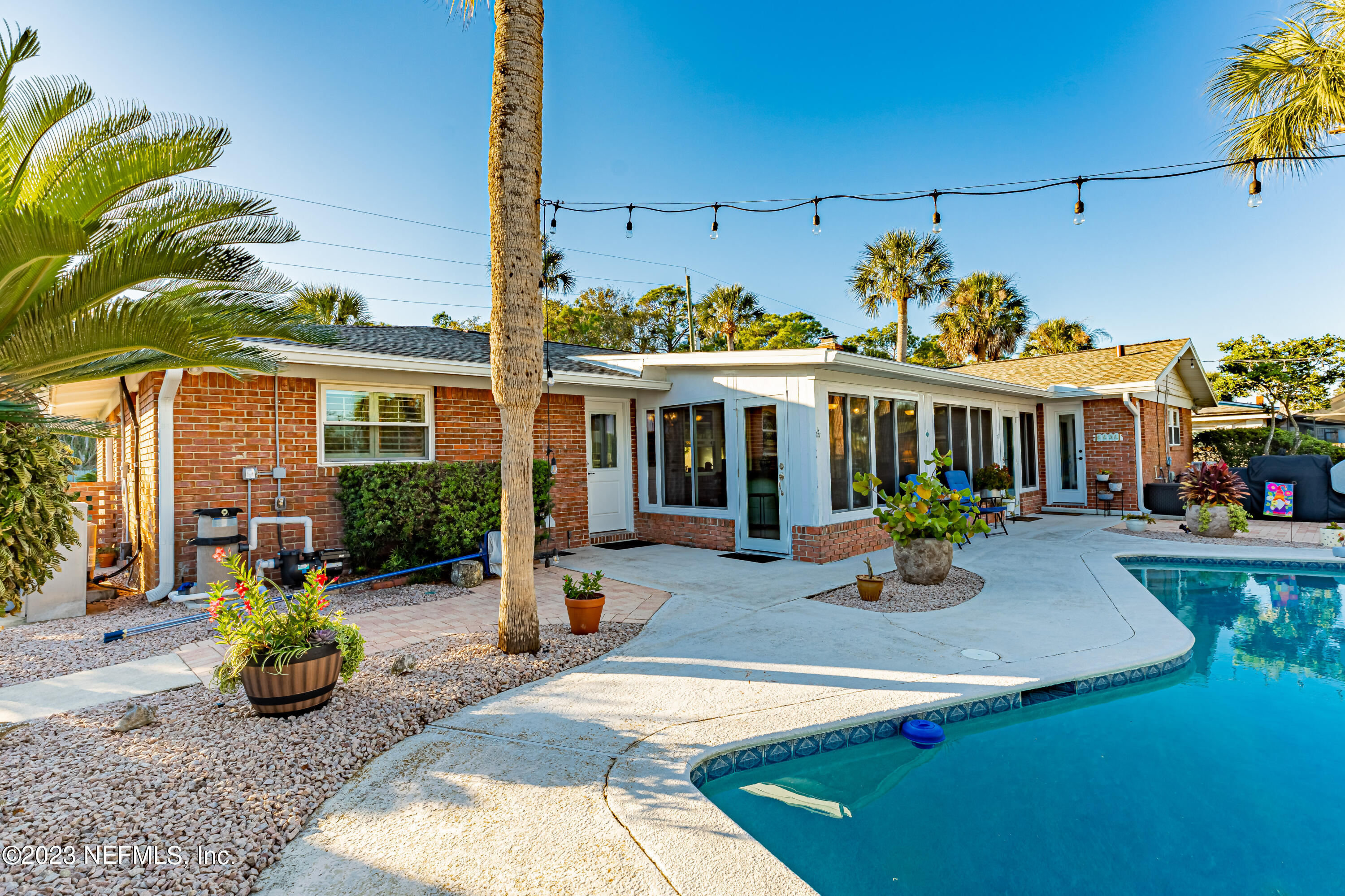 3467 Eunice Road Jacksonville, FL 32250 - Photo 61 of 83 a view of a house with backyard porch and sitting area