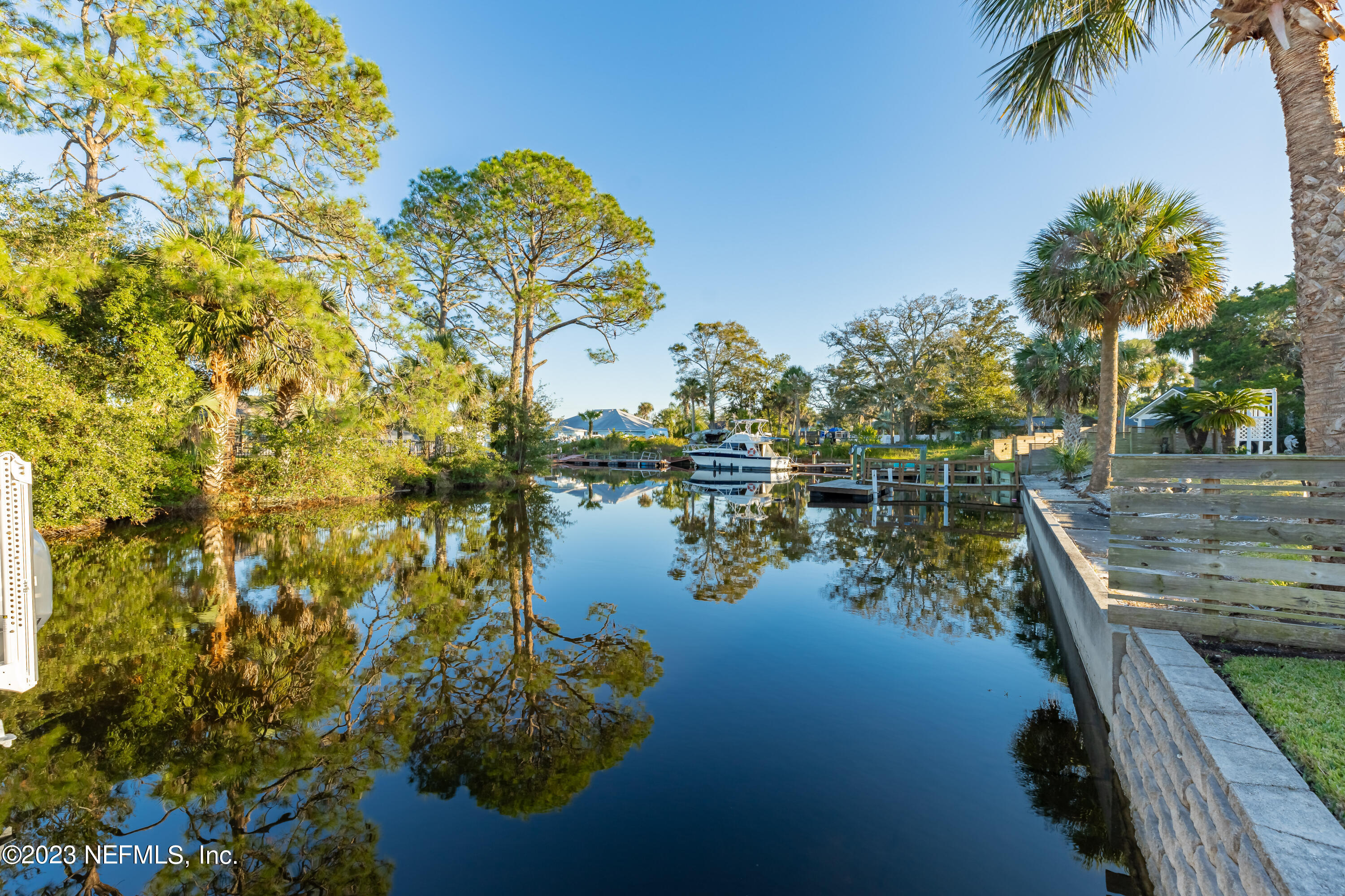 3467 Eunice Road Jacksonville, FL 32250 - Photo 73 of 83 a view of a lake with a building in the background