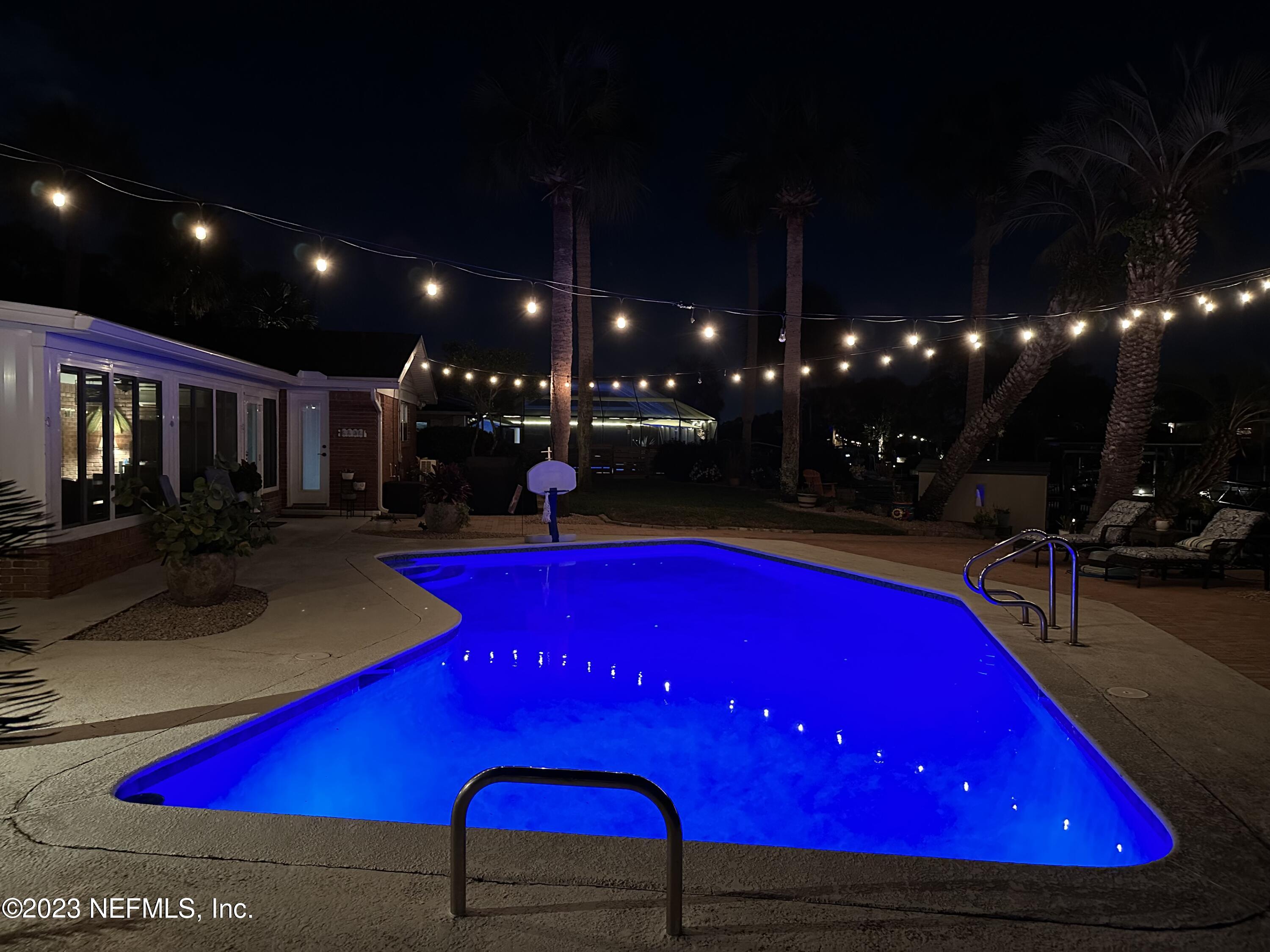 3467 Eunice Road Jacksonville, FL 32250 - Photo 78 of 83 a view of swimming pool with red chairs