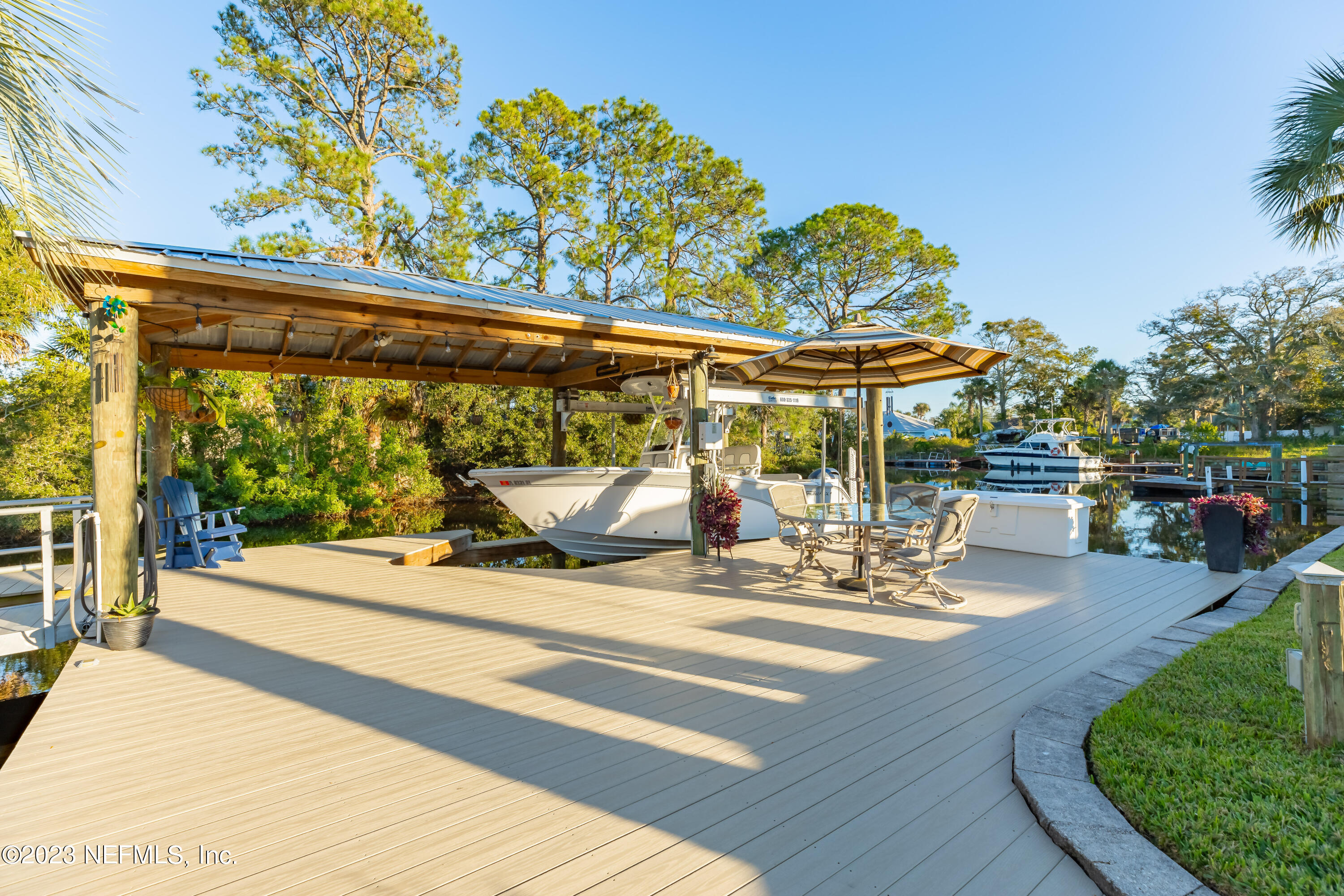 3467 Eunice Road Jacksonville, FL 32250 - Photo 10 of 83 a view of a patio with a table and chairs under an umbrella