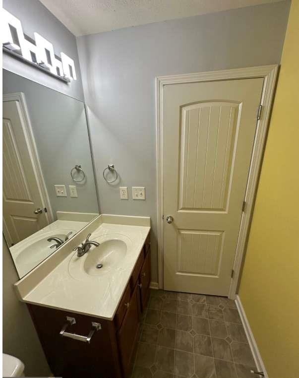 5103 Jack Drive Decatur, GA 30035 - Photo 21 of 34 a bathroom with a sink a vanity and a mirror