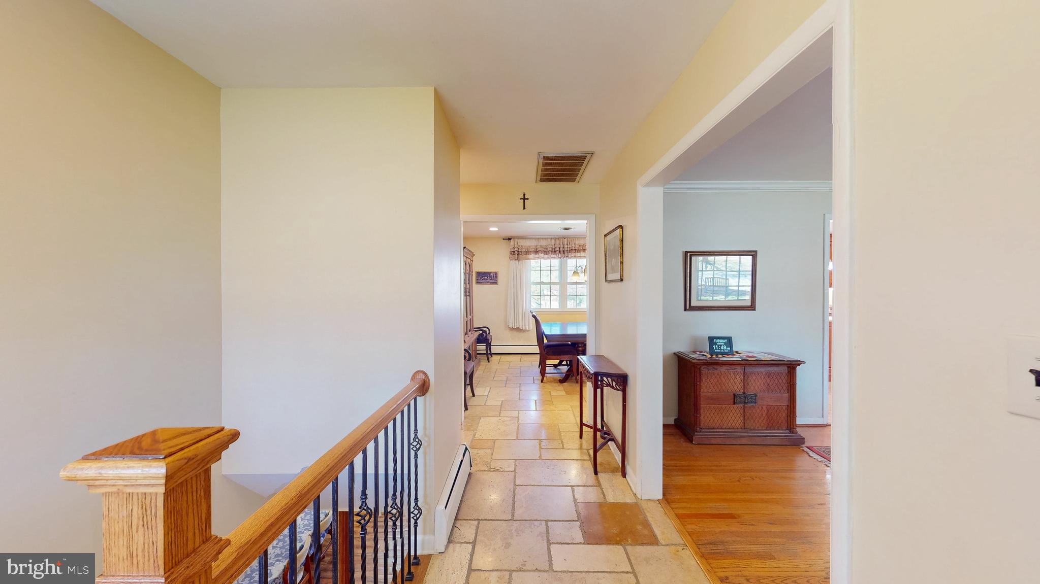 9126 Dunloggin Road Ellicott City, MD 21042 - Photo 41 of 41 a view of a hallway with wooden floor and windows