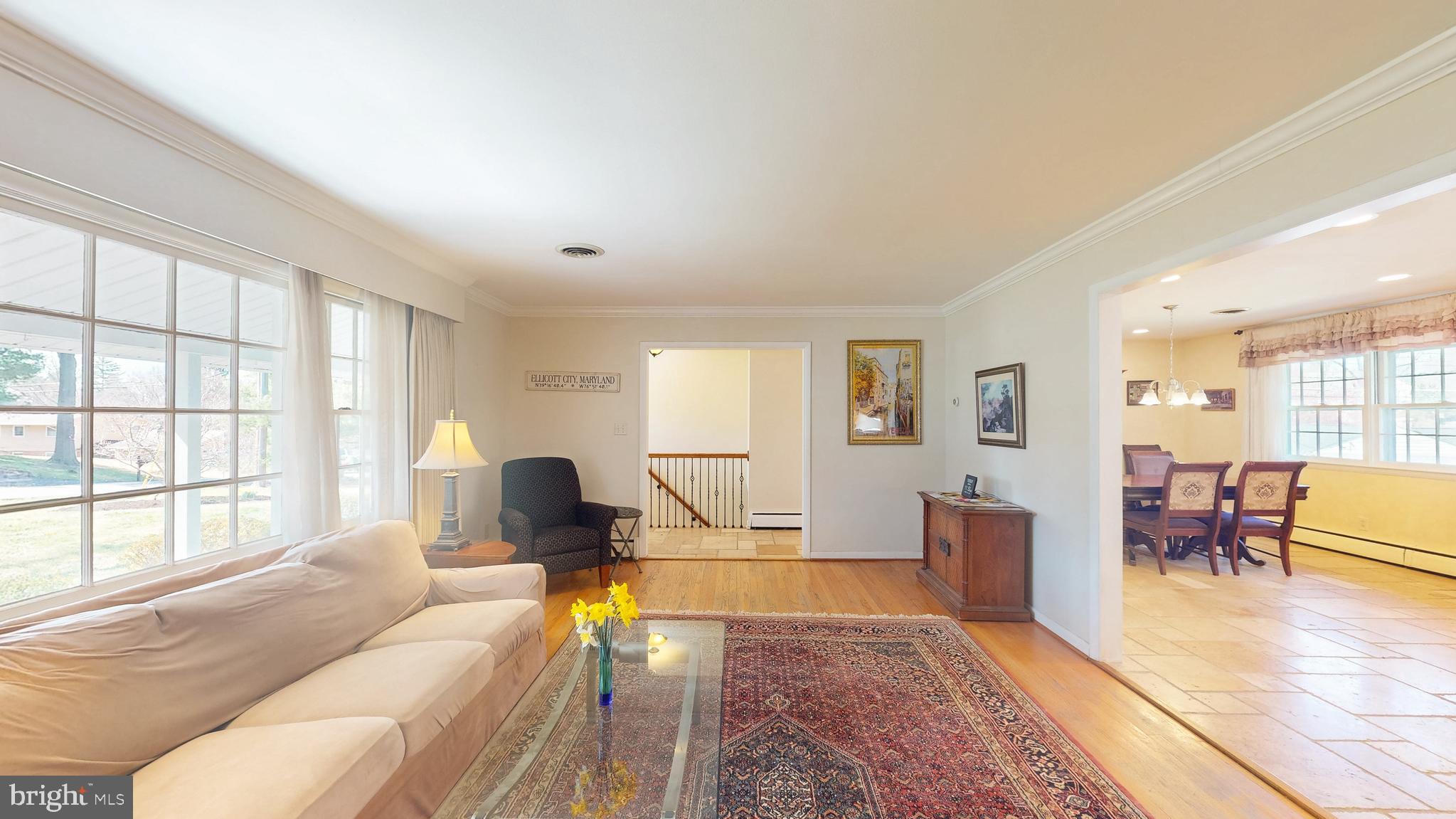 9126 Dunloggin Road Ellicott City, MD 21042 - Photo 6 of 41 a living room with furniture and a large window