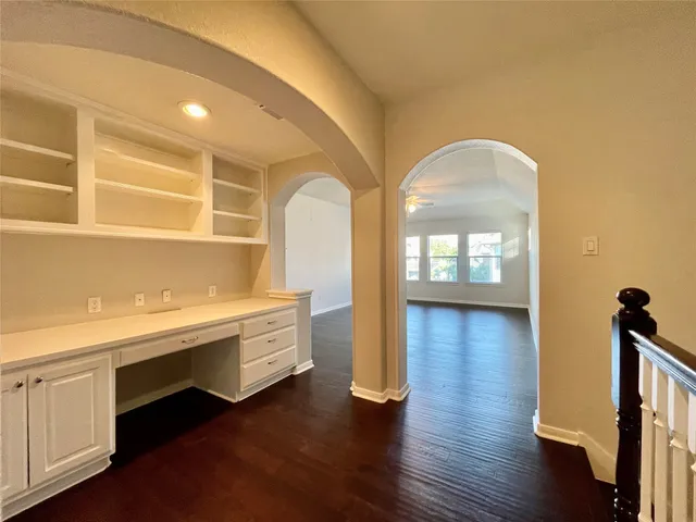 a room with wooden floors and view