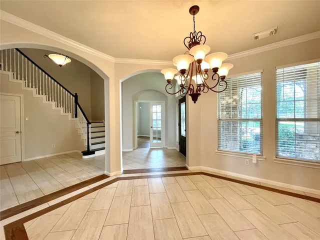 a view of a livingroom with a ceiling fan and window