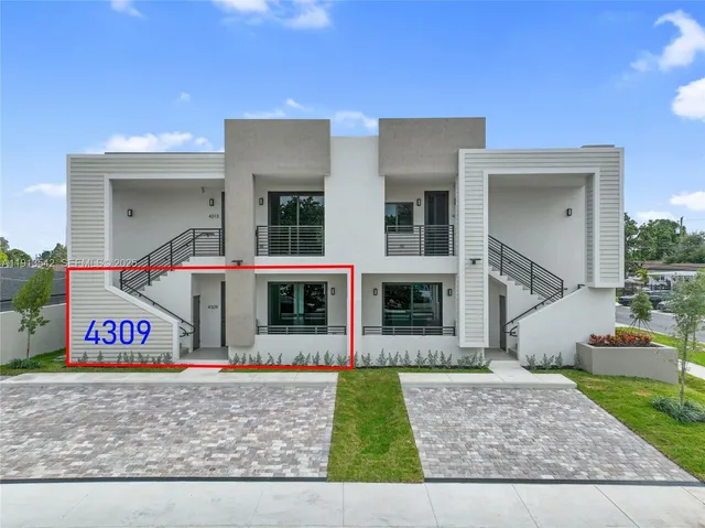a kitchen with stainless steel appliances a stove refrigerator sink and cabinets