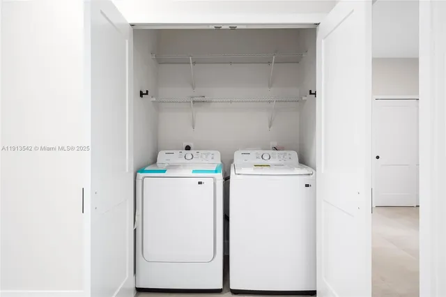 a view of a living room with a large window
