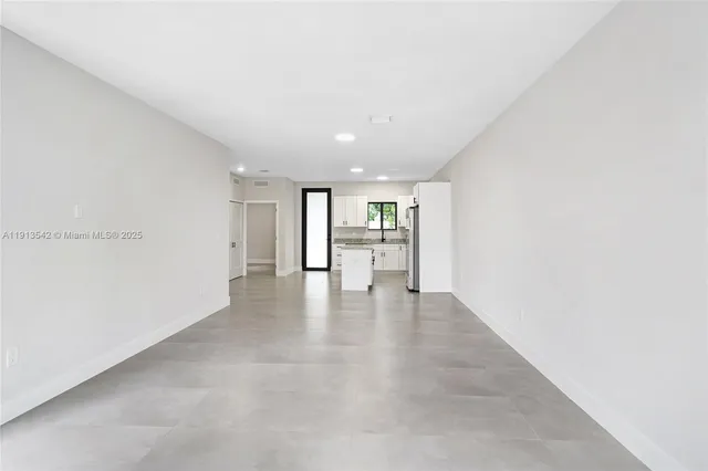 a view of a livingroom and a hallway