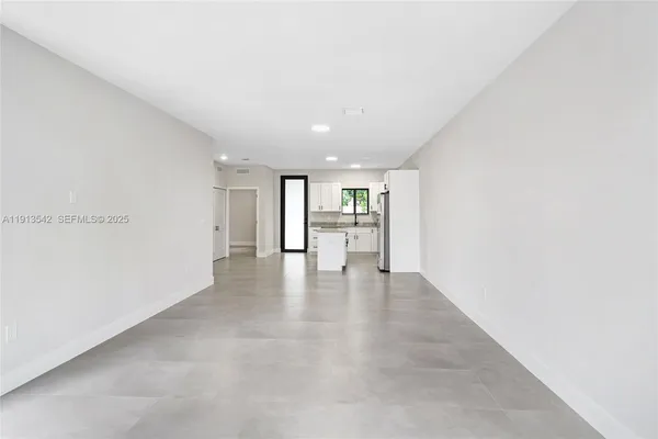 a view of a livingroom and a hallway