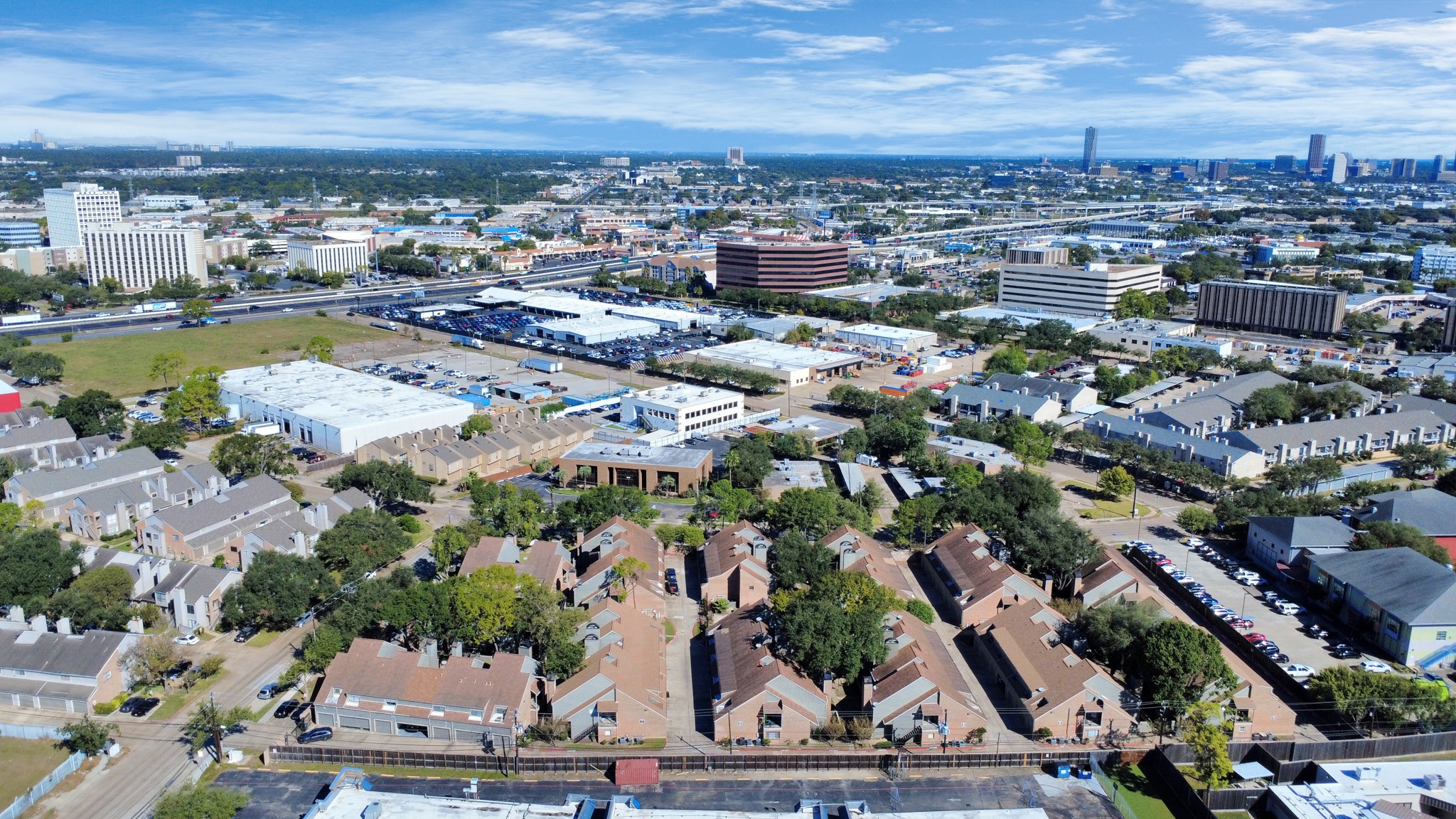 6601 Sands Point Drive, Unit 47 Houston, TX 77074 - Photo 46 of 46 an aerial view of a city with lots of residential buildings ocean and mountain view in back