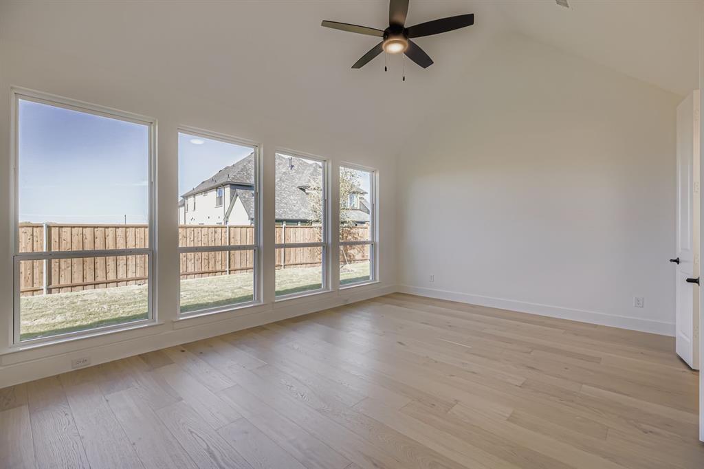 2650 Merrell Court Prosper, TX 75078 - Photo 10 of 28 an empty room with wooden floor and windows