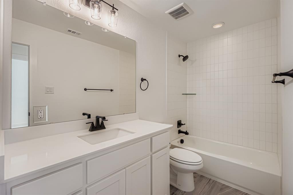 2650 Merrell Court Prosper, TX 75078 - Photo 17 of 28 a bathroom with a sink a toilet and shower