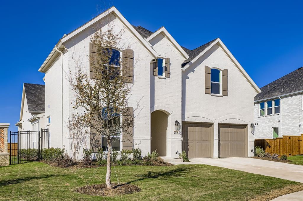2650 Merrell Court Prosper, TX 75078 - Photo 2 of 28 a front view of a house with a yard