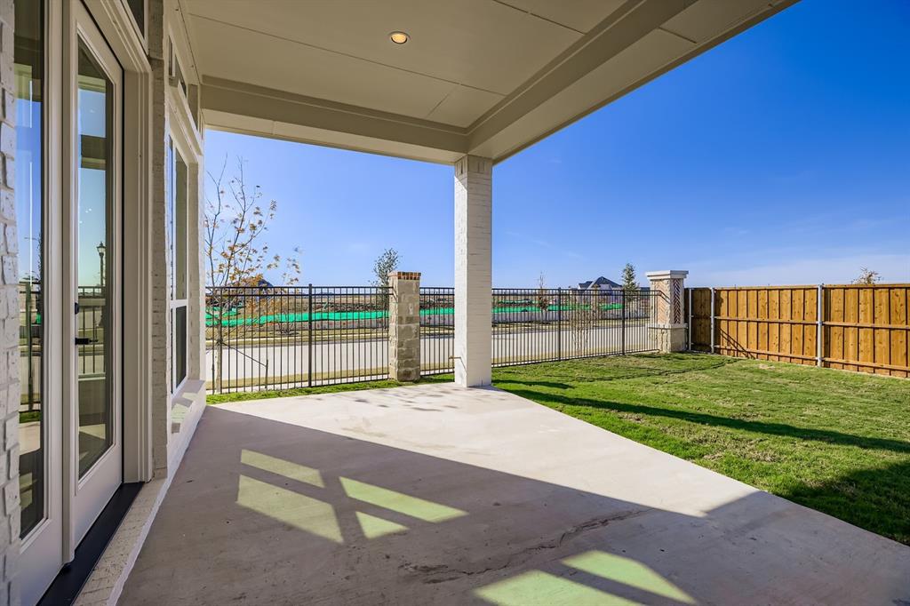 2650 Merrell Court Prosper, TX 75078 - Photo 24 of 28 a living room with a large bed and a large window