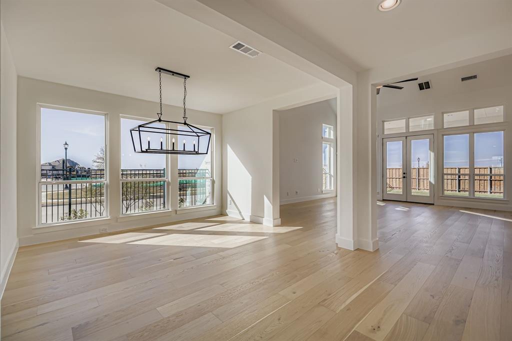 2650 Merrell Court Prosper, TX 75078 - Photo 6 of 28 a view of an empty room with wooden floor and a window